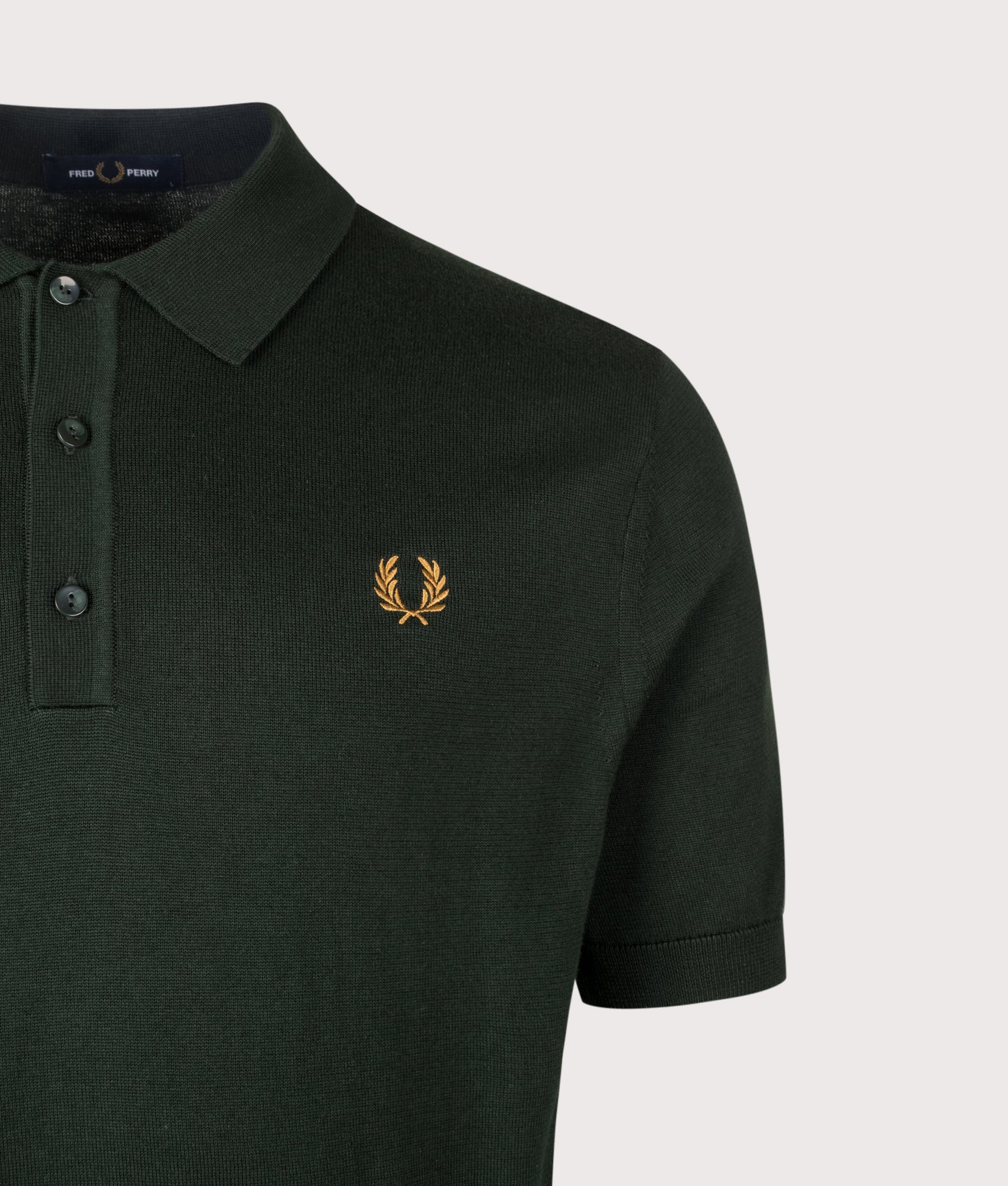 Fred Perry Long Staple Cotton Knitted Polo Shirt in Night Green at EQVVS Menswear. Detail shot.