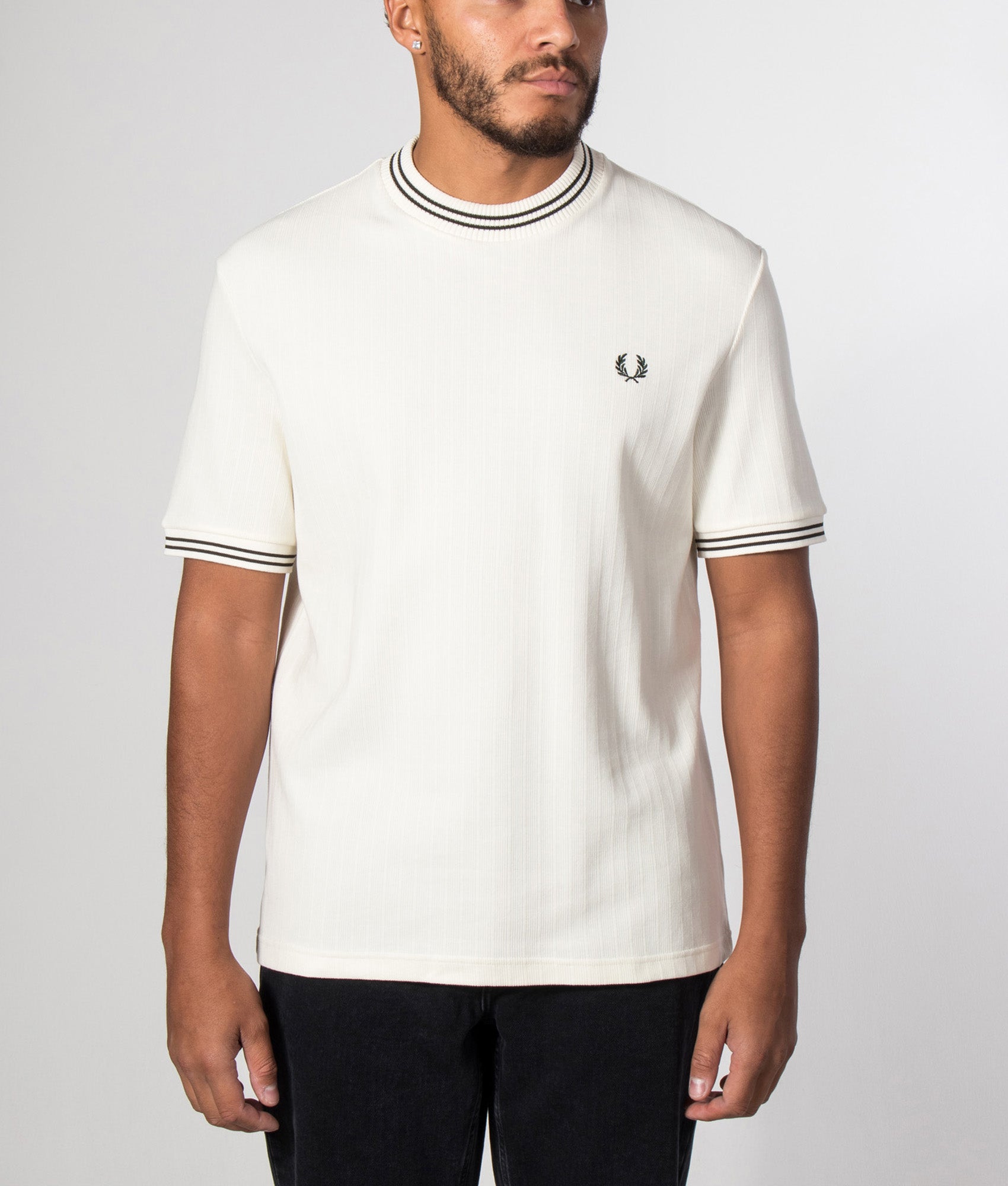 Fred Perry Regular Fit Ribbed Jersey T-Shirt in Ecru at EQVVS Menswear. Model front shot.
