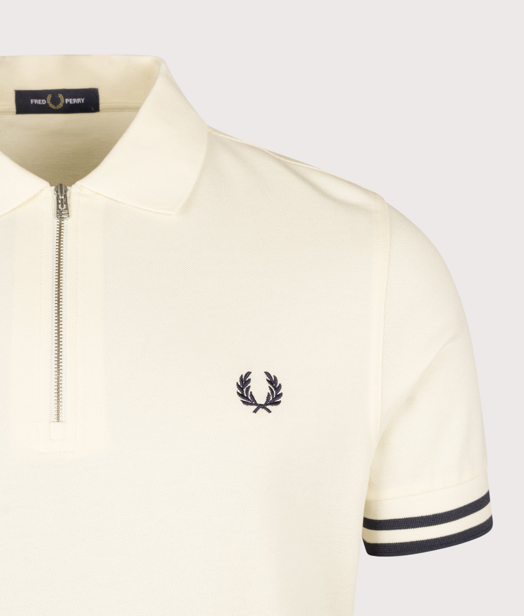 Fred Perry Regular Fit Bold Tipped Polo Shirt in Ecru at EQVVS Menswear. Detail shot.