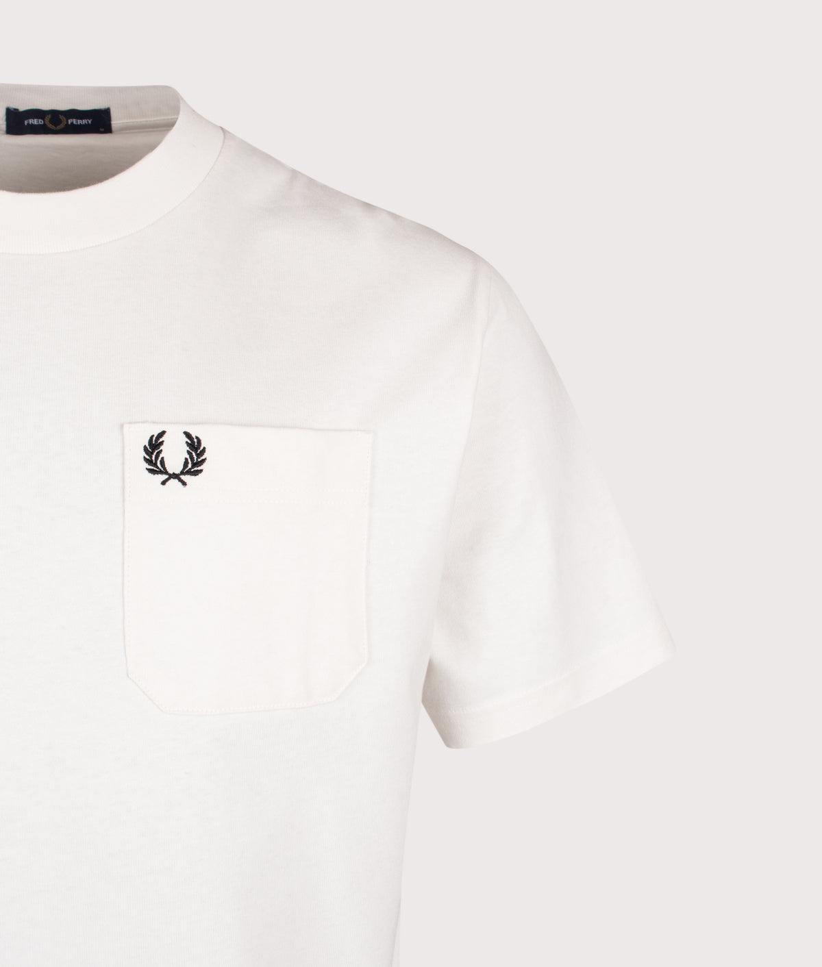 Fred Perry Relaxed Fit T-Shirt in Snow White at EQVVS Menswear. Detail shot.