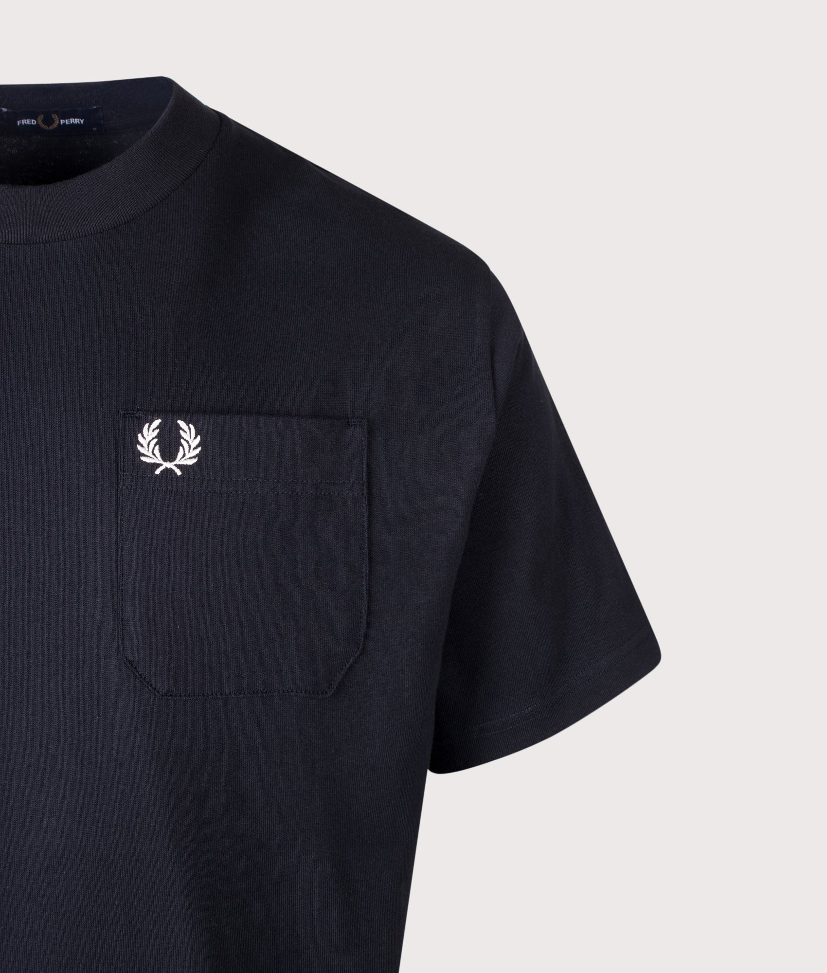 Fred Perry Relaxed Fit T-Shirt in Navy at EQVVS Menswear. Detail shot.