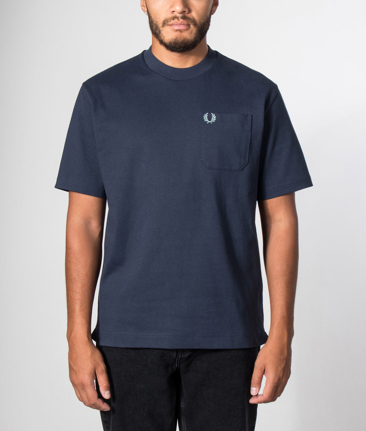 Fred Perry Relaxed Fit T-Shirt in Dark Airforce at EQVVS Menswear. Model front shot.