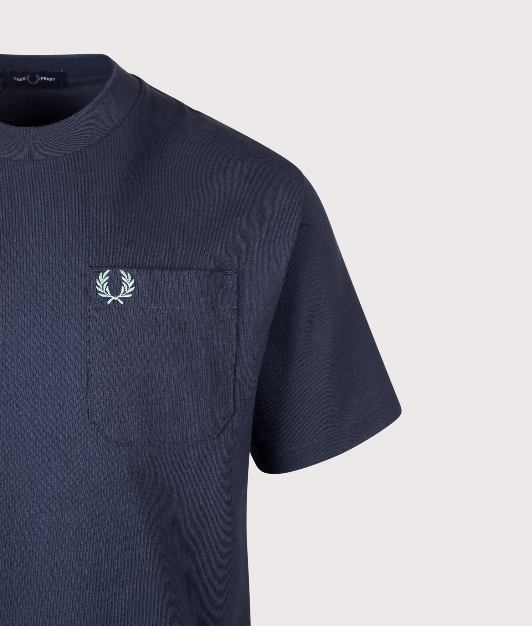 Fred Perry Relaxed Fit T-Shirt in Dark Airforce at EQVVS Menswear. Detail shot.