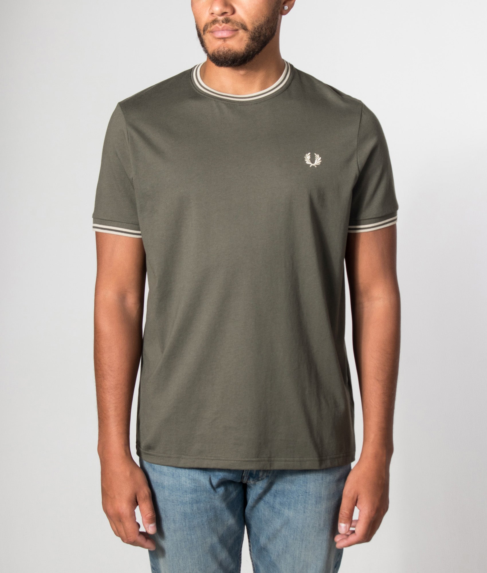 Fred Perry Regular Fit Twin Tipped T-Shirt in Field Green and Oatmeal at EQVVS Menswear. Model front shot.