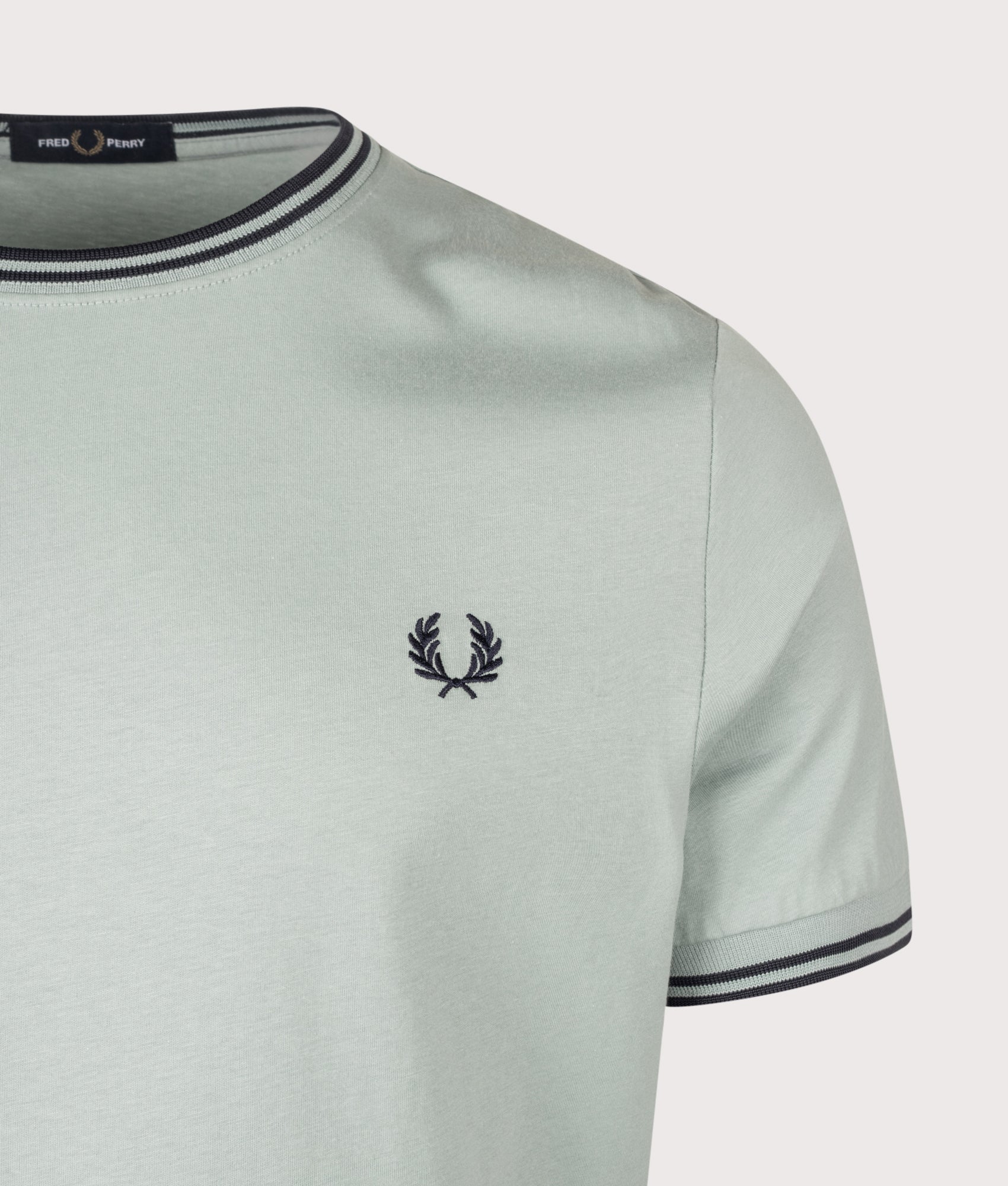 Fred Perry Twin Tipped T-Shirt in Silver Blue and Dark Airforce at EQVVS Menswear. Detail shot.