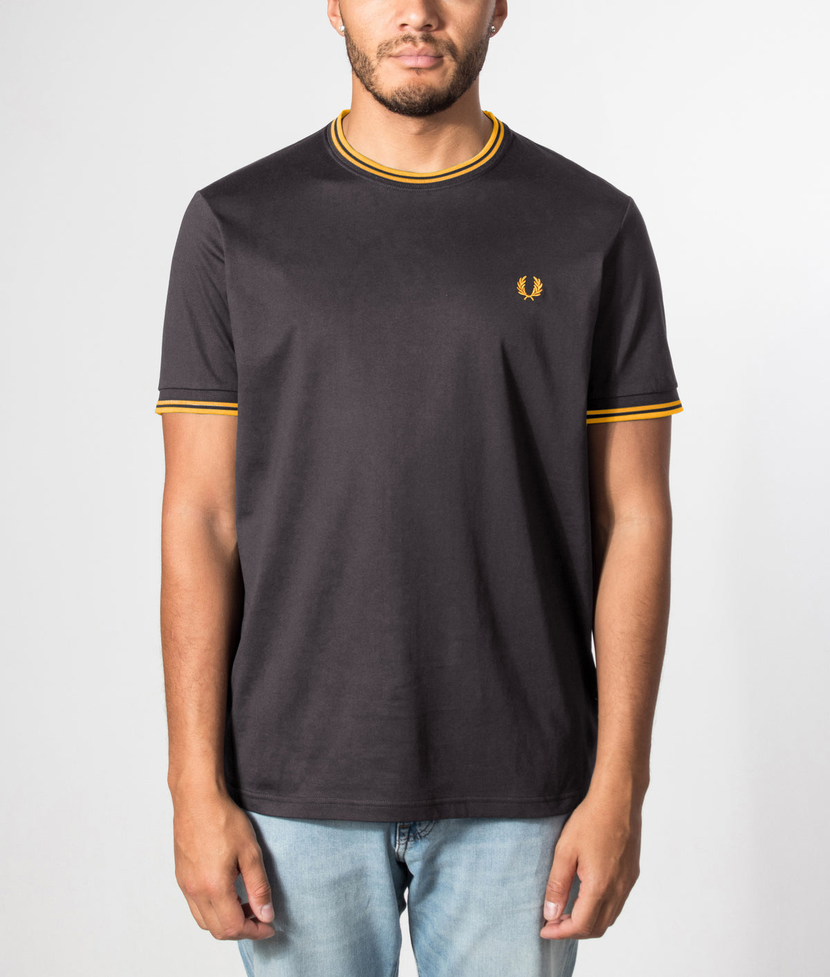 Fred Perry Regular Fit Twin Tipped T-Shirt in Anchor Grey and Golden at EQVVS Menswear. Front model shot.