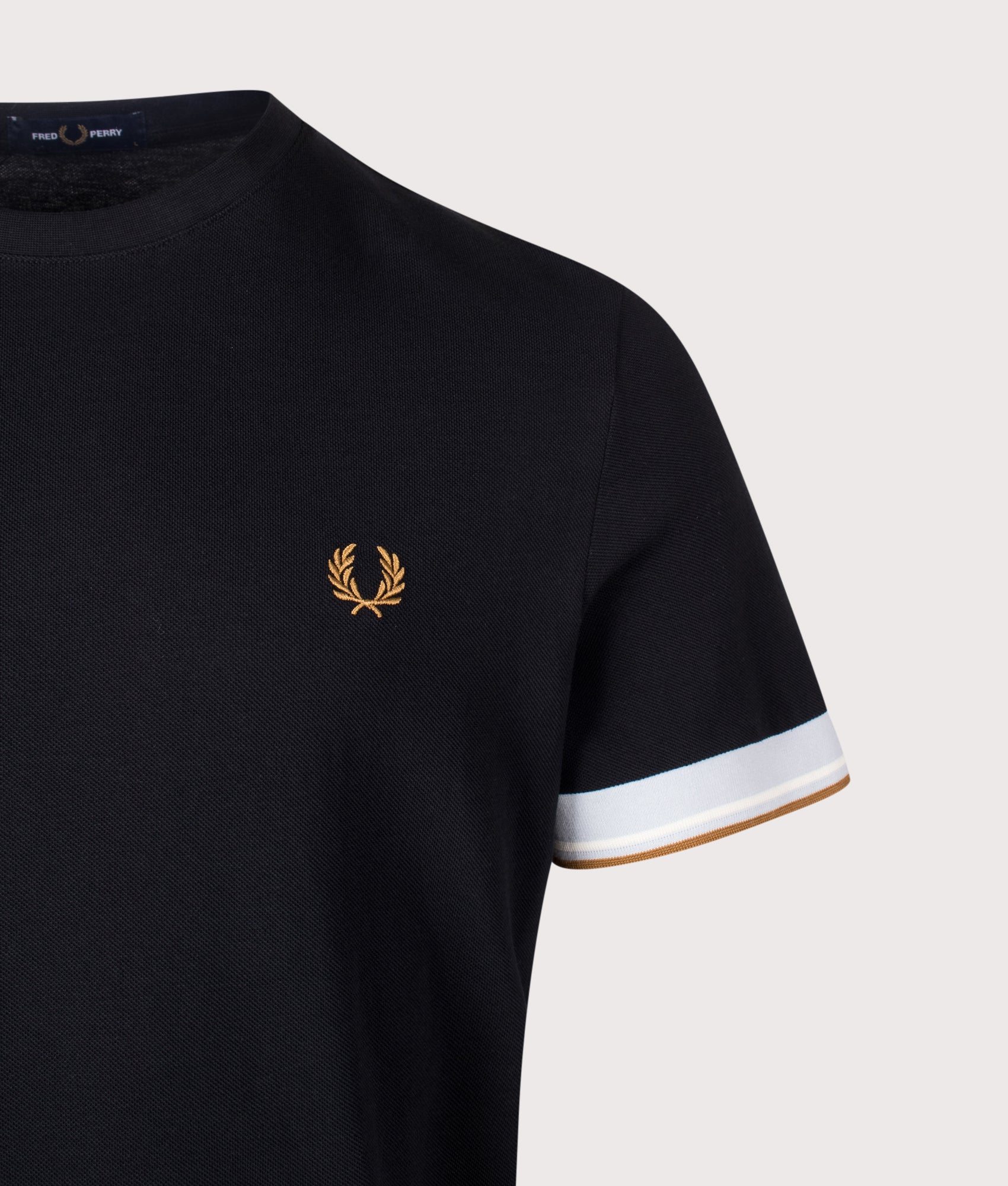 Fred Perry Regular Fit Twin Tipped Cuff T-Shirt in Black at EQVVS Menswear. Detail shot.