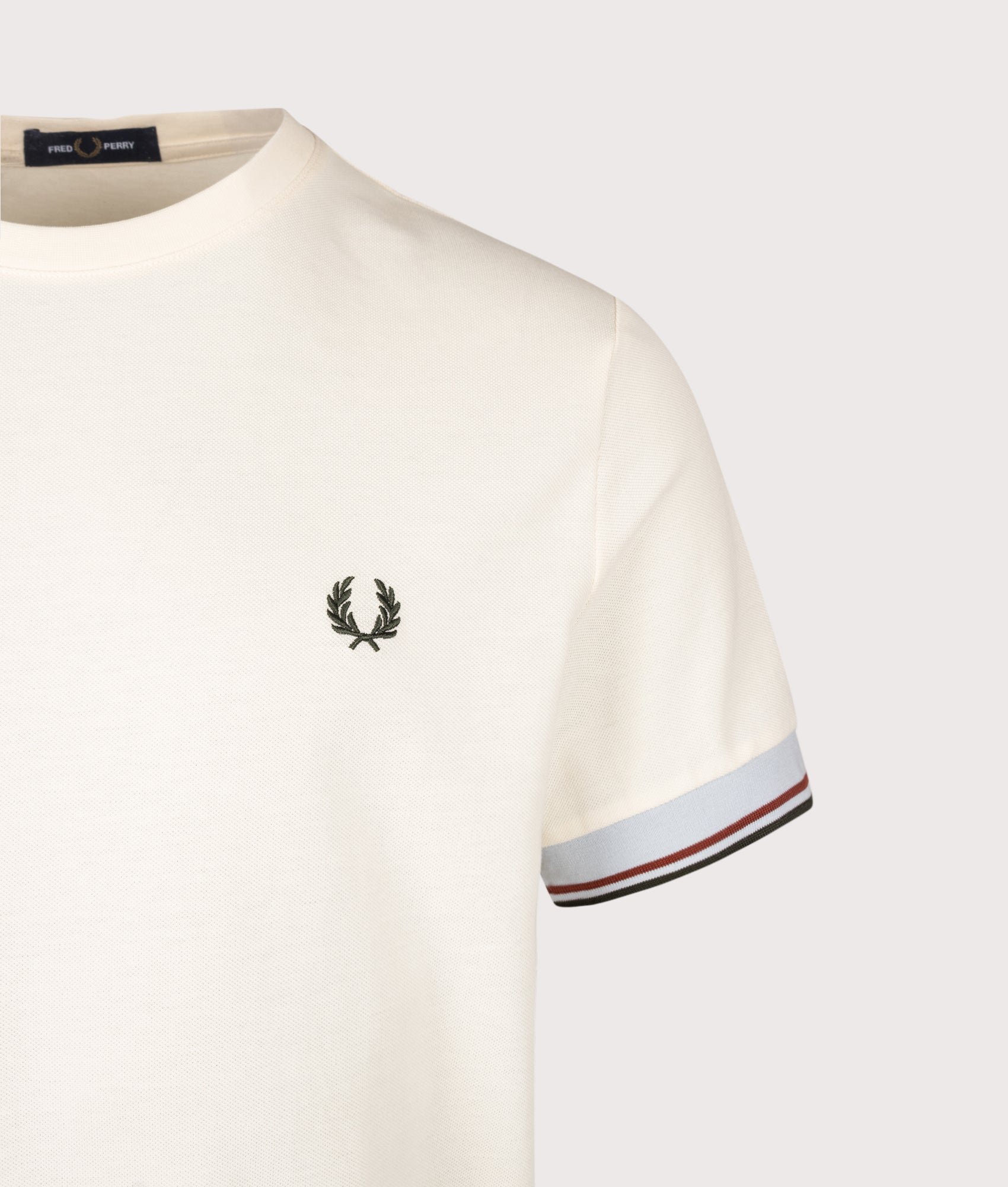 Fred Perry Regular Fit Twin Tipped Cuff T-Shirt in Ecru at EQVVS Menswear. Detail shot.