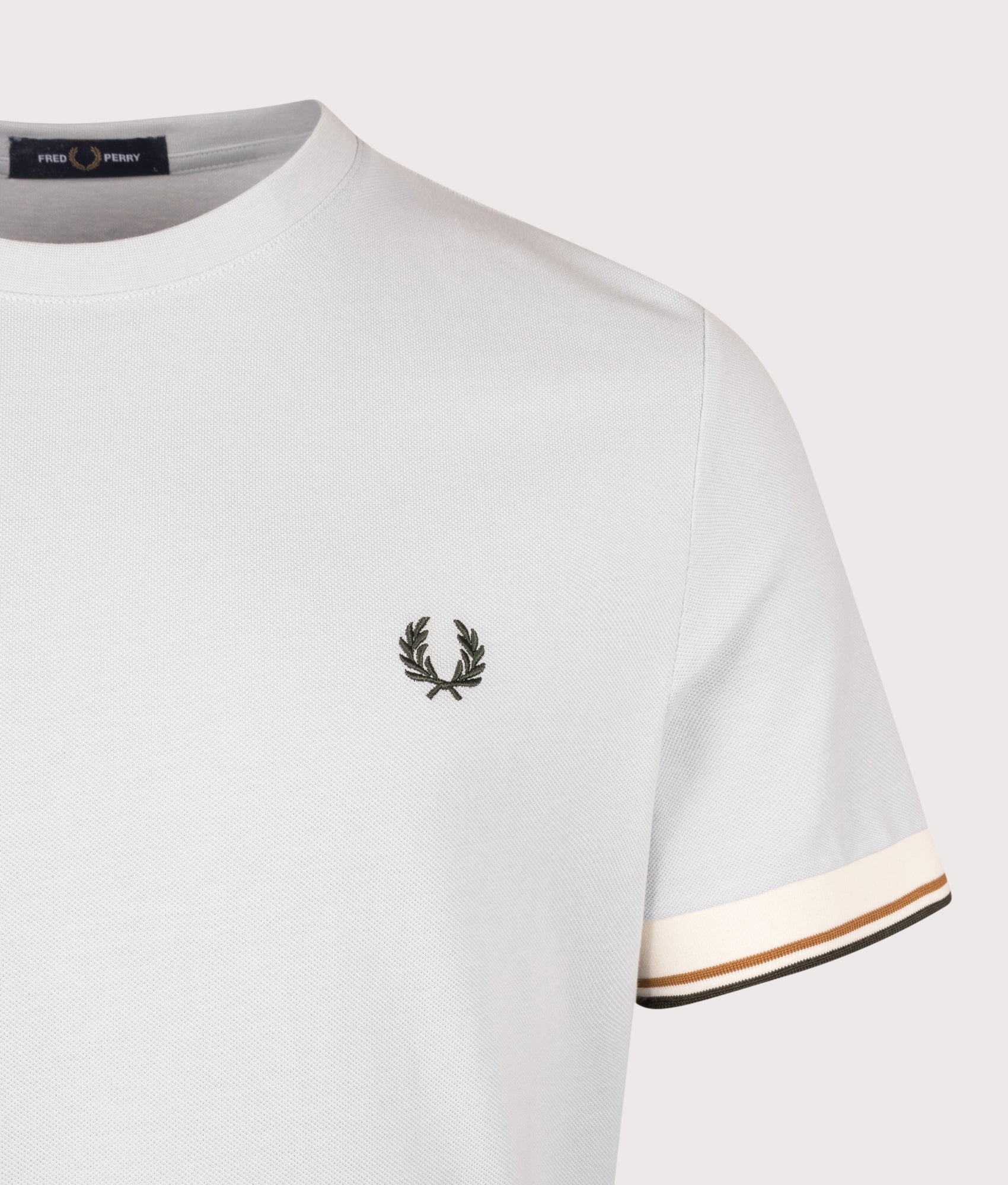 Fred Perry Regular Fit Twin Tipped Cuff T-Shirt in Dusky Blue at EQVVS Menswear. Detail shot.
