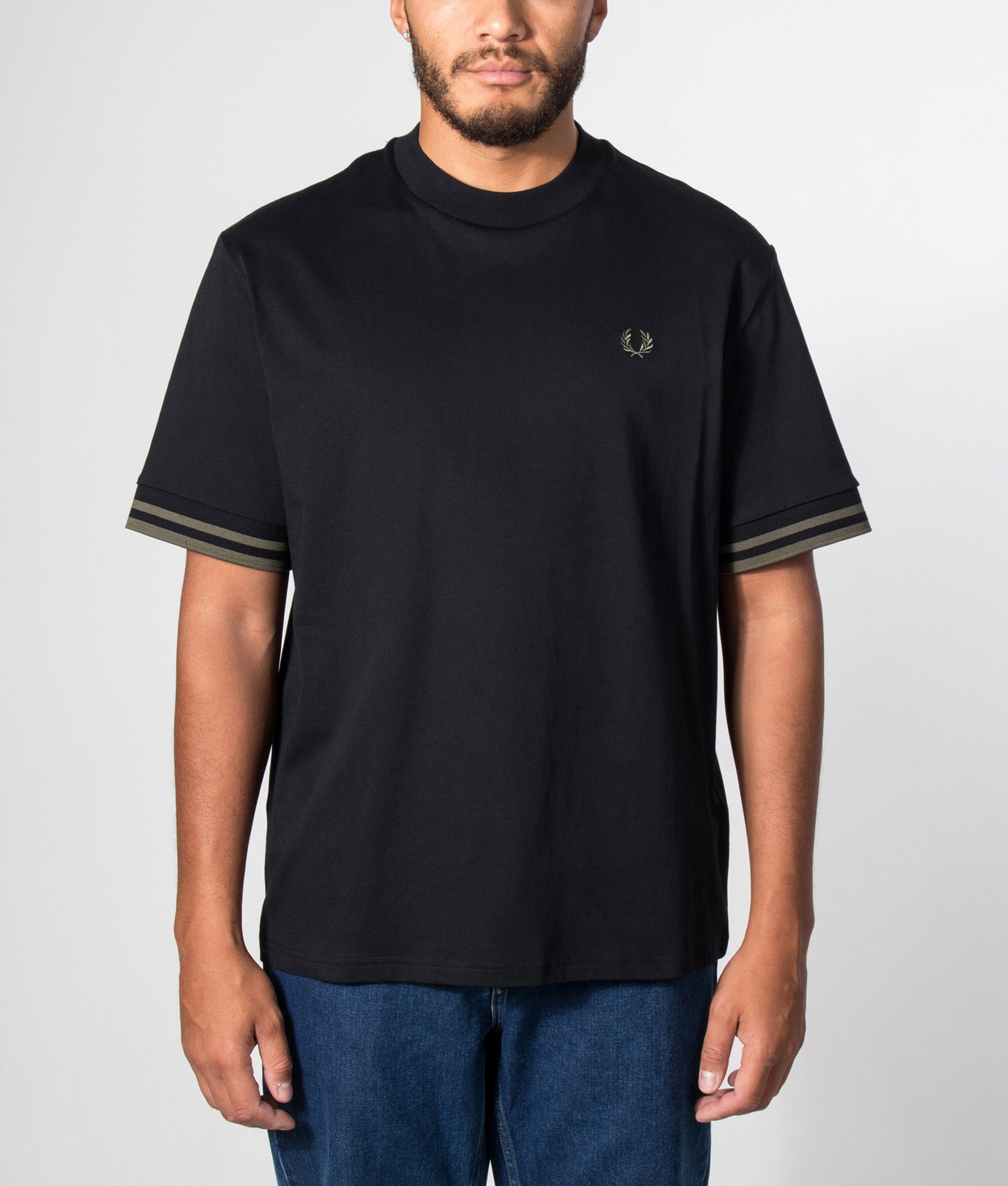 Fred Perry Relaxed Fit Bold Tipped T-Shirt in Black at EQVVS Menswear. Model front shot.