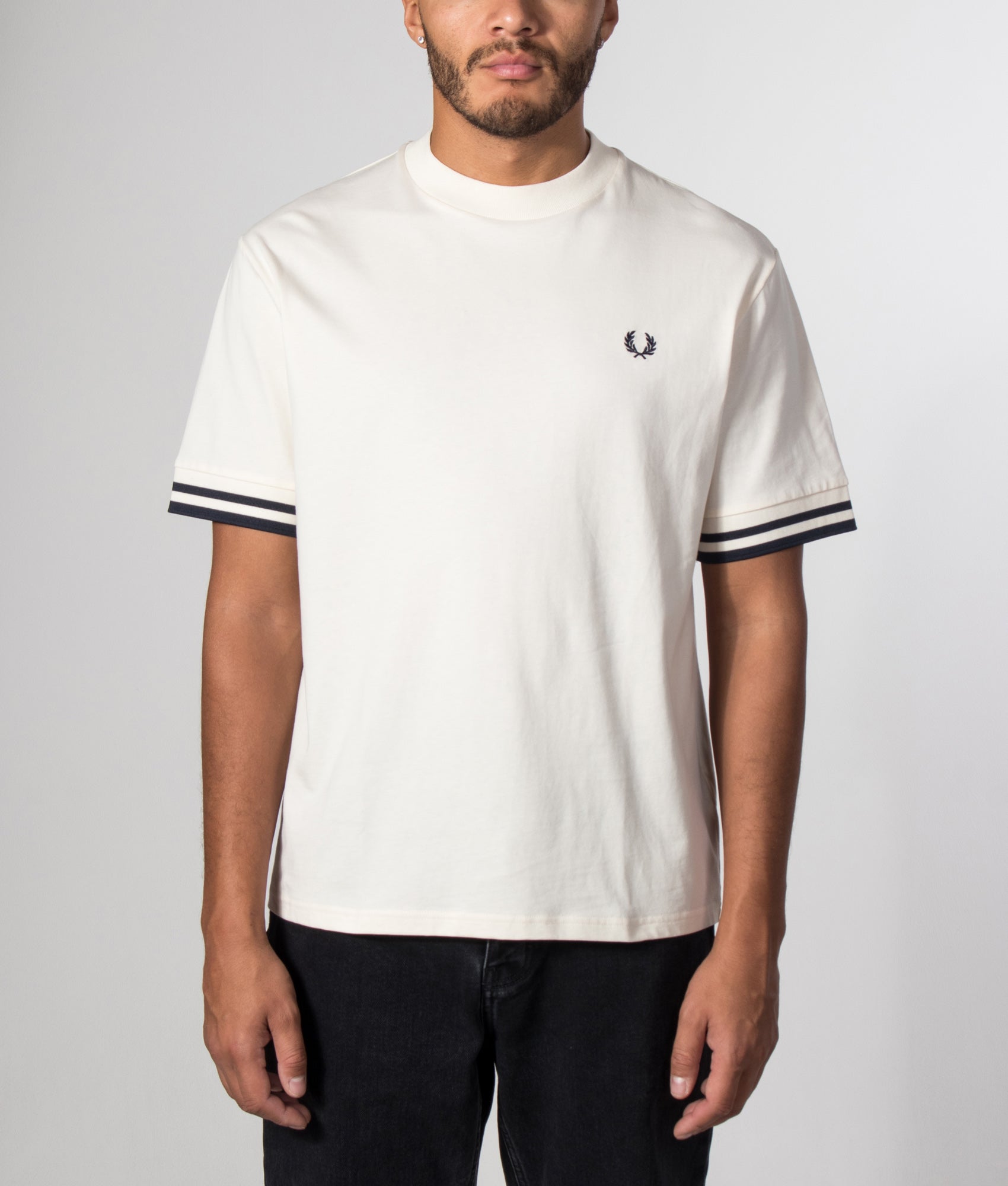 Fred Perry Relaxed Fit Bold Tipped T-Shirt in Ecru at EQVVS Menswear. Model front shot.