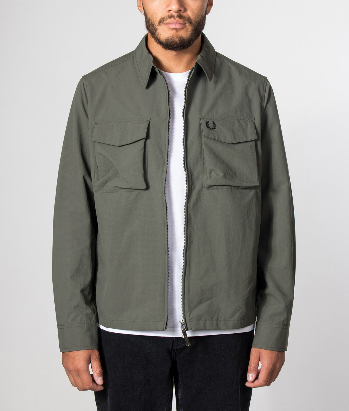 Fred Perry Ripstop Pocket Overshirt in Field Green at EQVVS Menswear. Model front shot.