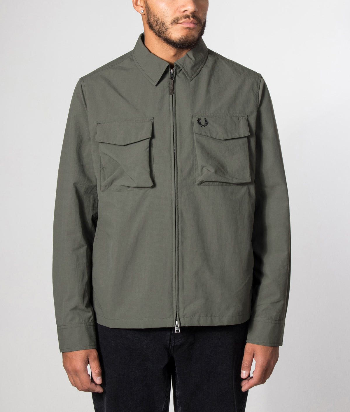Fred Perry Ripstop Pocket Overshirt in Field Green at EQVVS Menswear. Model front shot.