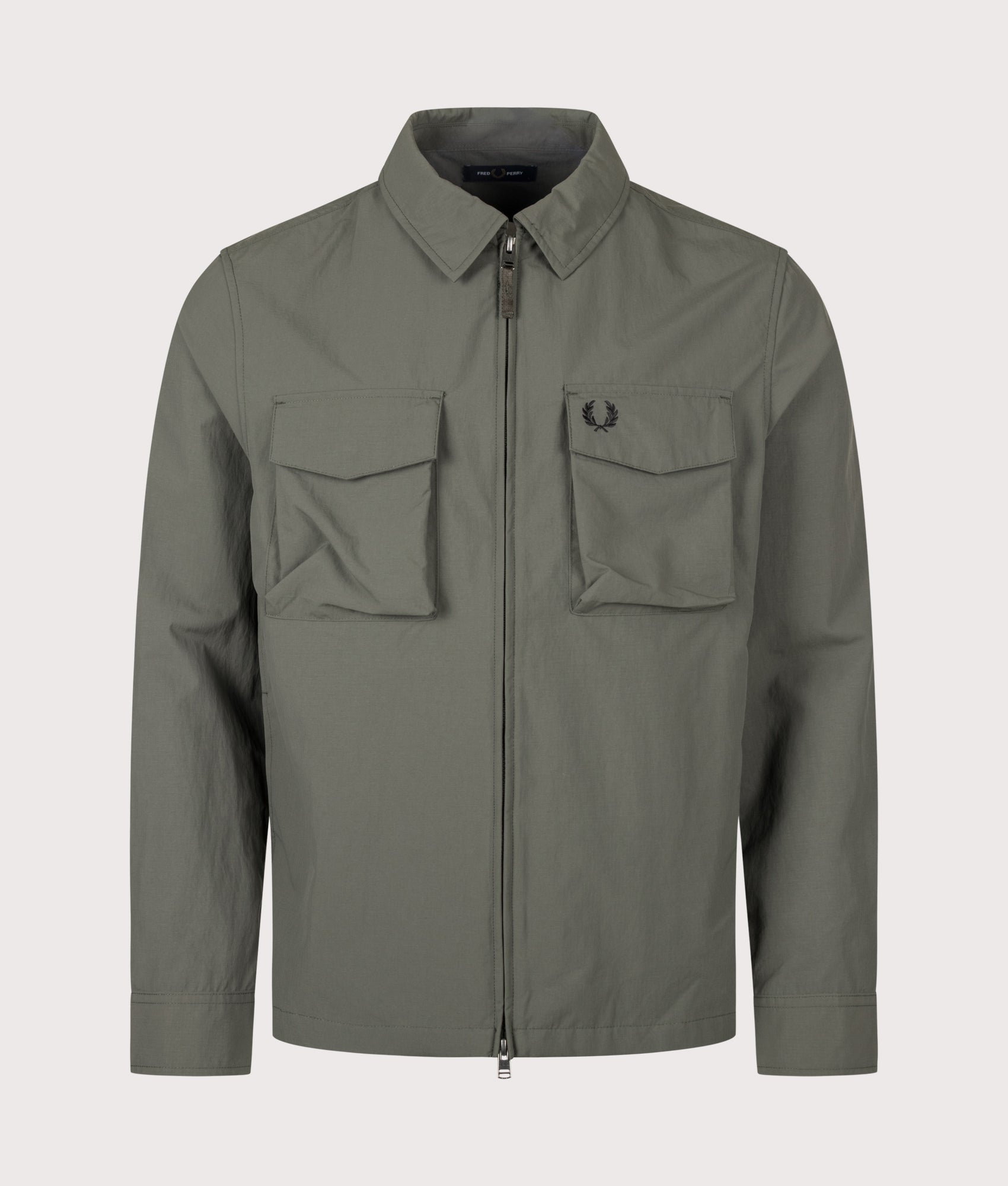 Fred Perry Ripstop Pocket Overshirt in Field Green at EQVVS Menswear. Front shot.