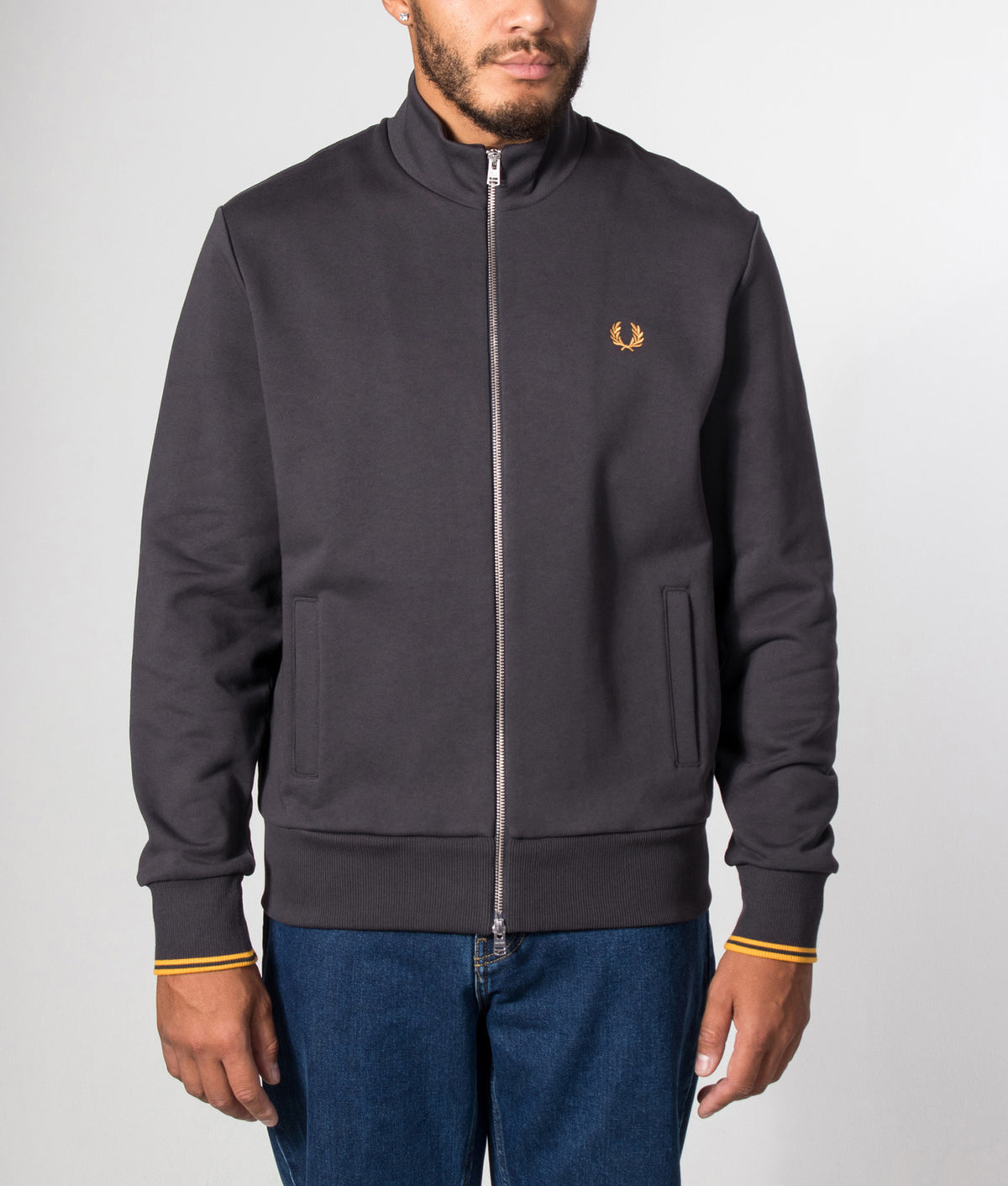 Fred Perry Regular Fit Track Top in Anchor Grey at EQVVS Menswear. Model front shot.