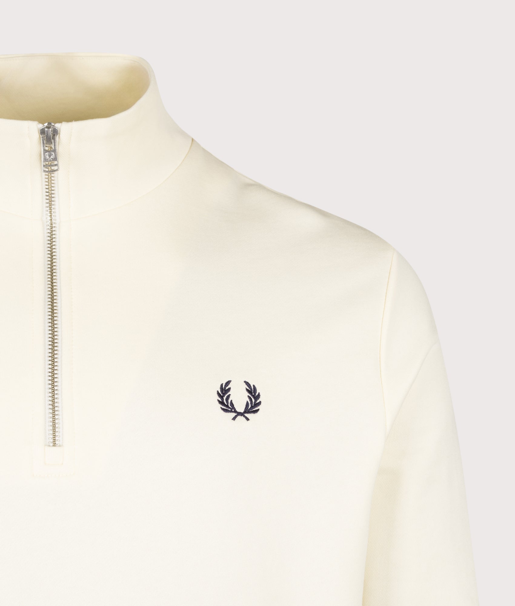Fred Perry Regular Fit Quarter Zip Sweatshirt in Ecru, Seagrass and Dark Airforce at EQVVS Menswear. Detail shot.