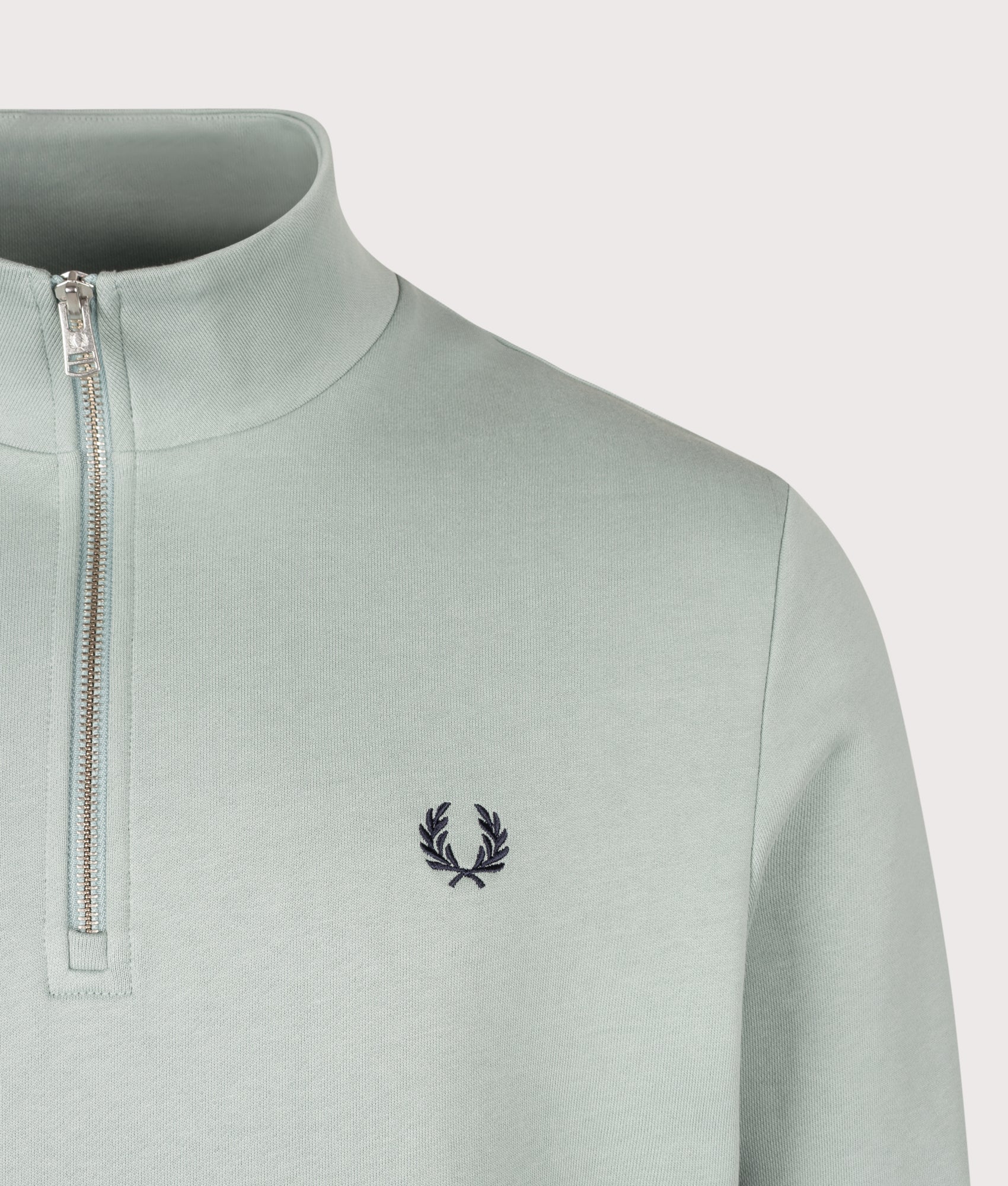 Fred Perry Regular Fit Quarter Zip Sweatshirt in Silver Blue and Dark Airforce at EQVVS Menswear. Detail shot.