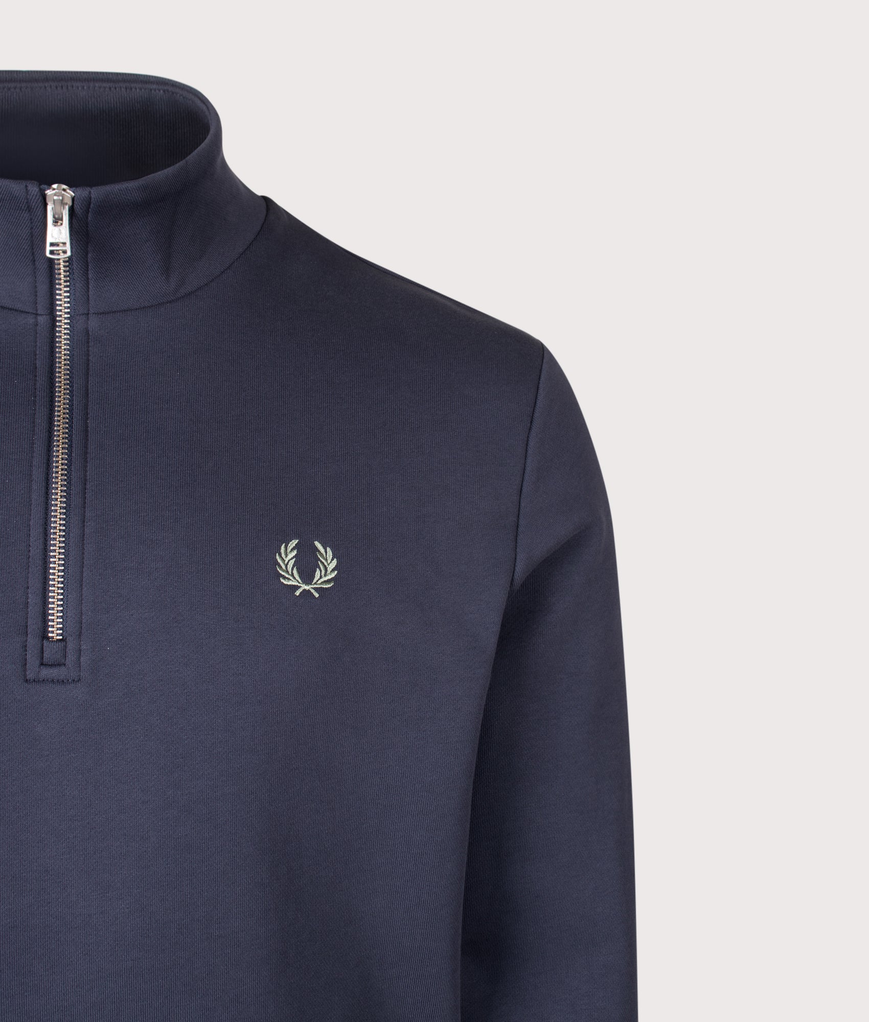 Fred Perry Regular Fit Quarter Zip Sweatshirt in Dark Airforce, Ecru and Seagrass at EQVVS Menswear. Detail shot.
