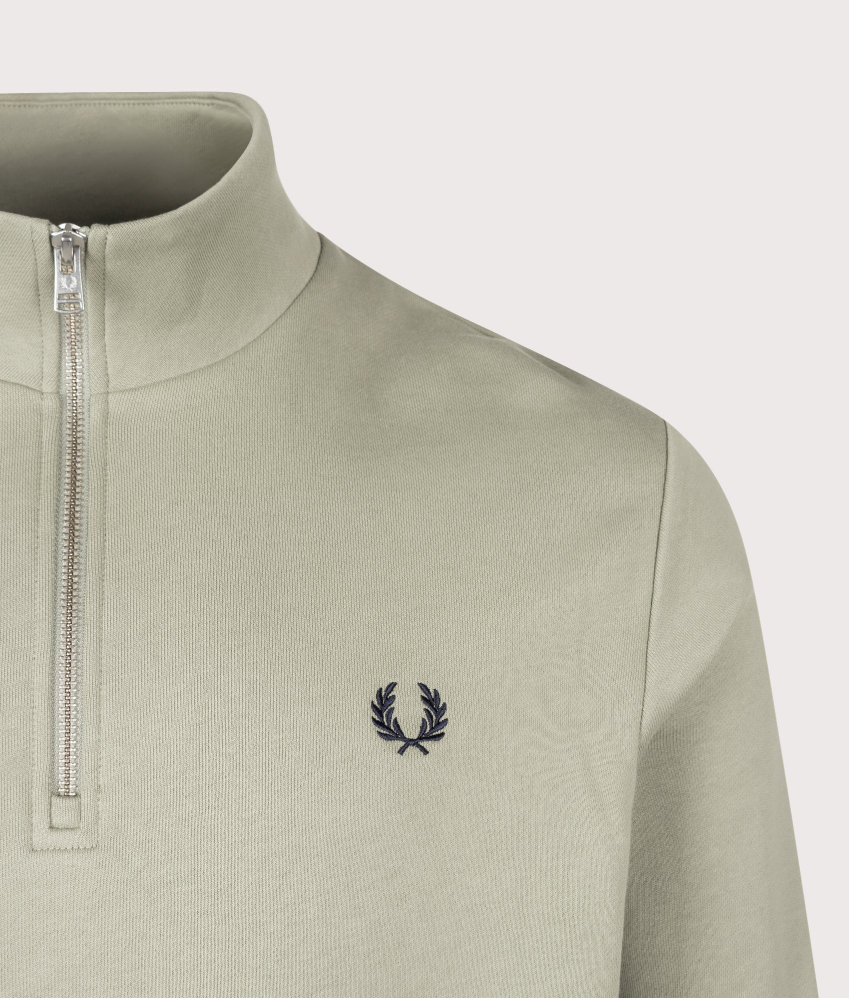 Fred Perry Regular Fit Quarter Zip Sweatshirt in Seagrass, Ecru and Dark Airforce at EQVVS Menswear. Detail shot.