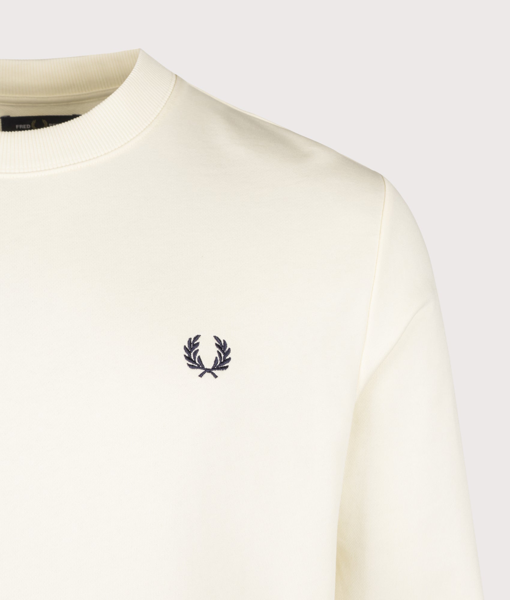 Fred Perry Regular Fit Crew Neck Sweatshirt in Ecru, Seagrass and Dark Airforce at EQVVS Menswear. Detail shot.