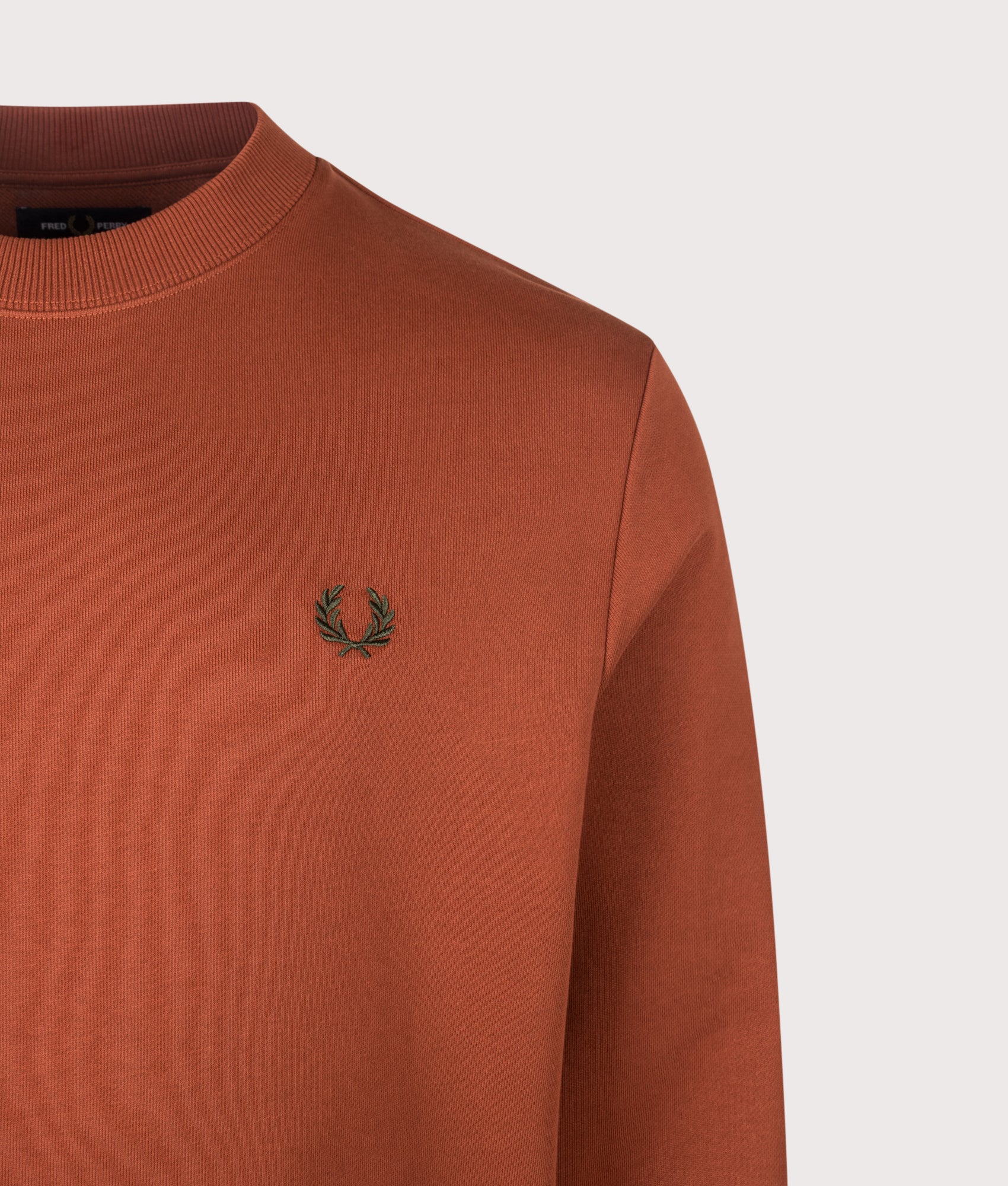 Fred Perry Regular Fit Crew Neck Sweatshirt in Brandy and Night Green at EQVVS Menswear. Detail shot.