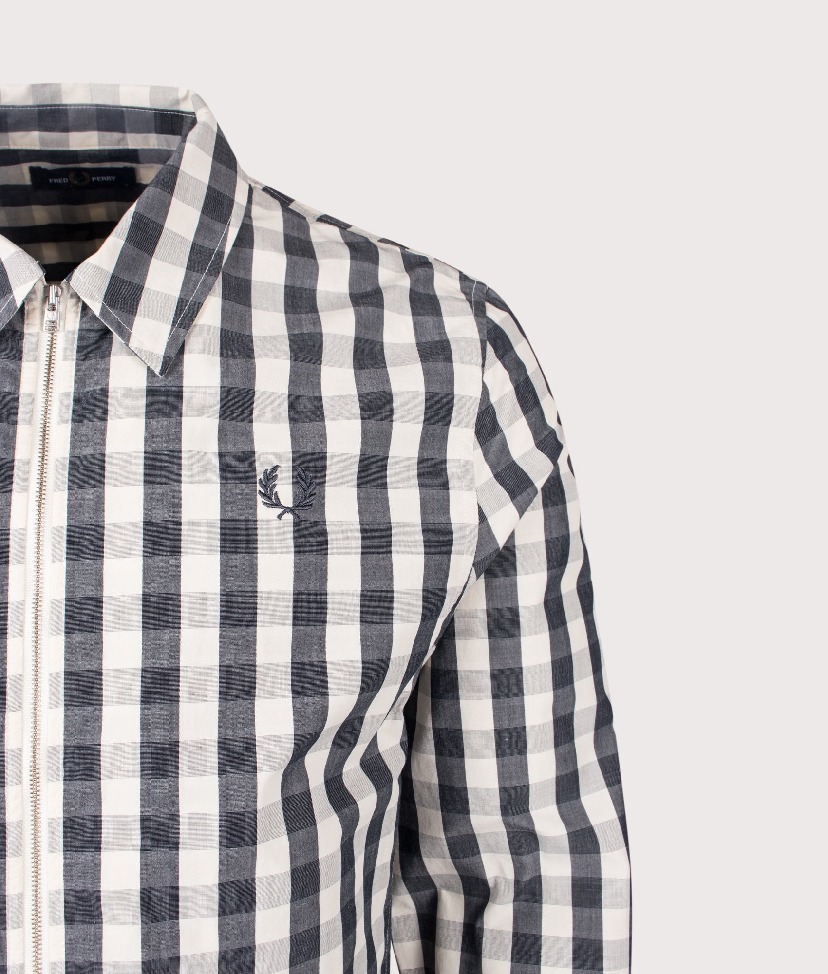 Fred Perry Poplin check Overshirt in Butter Cream at EQVVS Menswear. Detail shot.