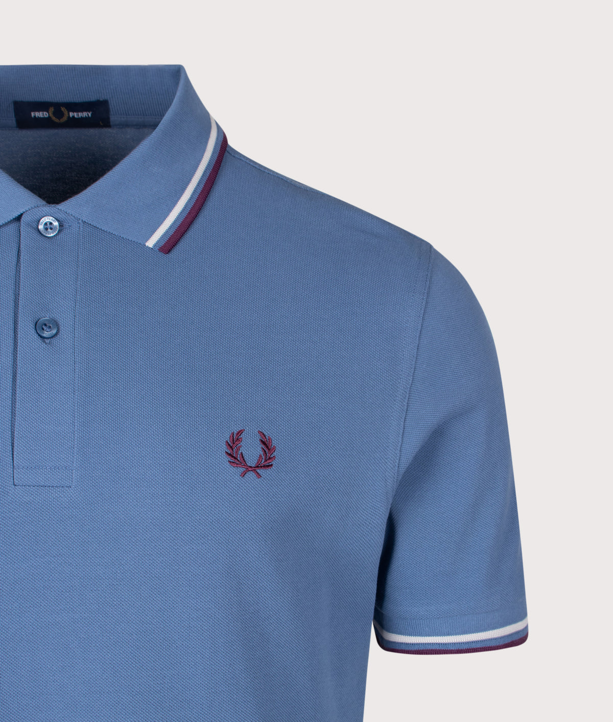 Fred Perry Twin Tipped Polo Shirt in Ace Blue, Slate and Plum at EQVVS Menswear. Detail shot.