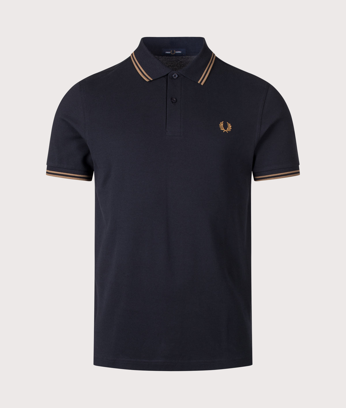 Fred Perry Twin Tipped Polo Shirt in Navy and Bronze at EQVVS Menswear. Front shot.
