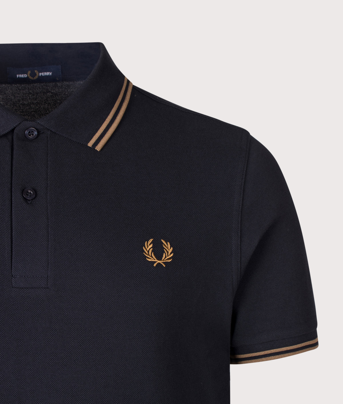 Fred Perry Twin Tipped Polo Shirt in Navy and Bronze at EQVVS Menswear. Detail shot.