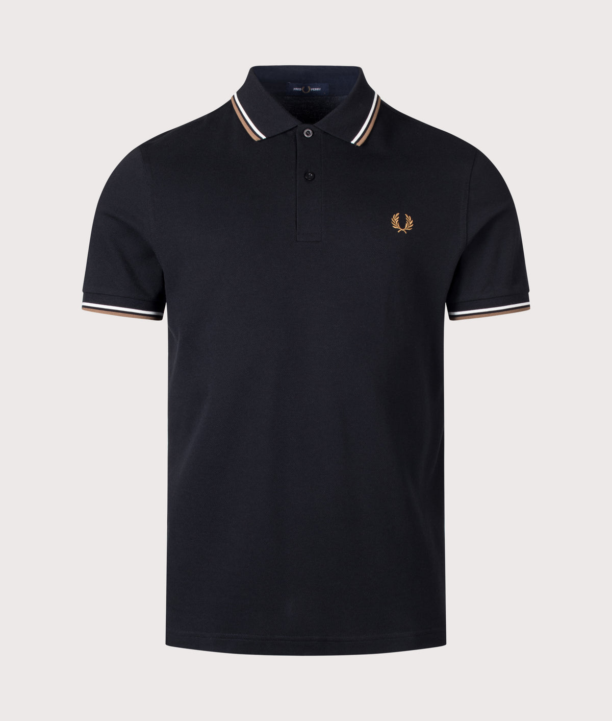 Fred Perry Twin Tipped Polo Shirt in Black, Snow White and Bronze at EQVVS Menswear. Front shot.