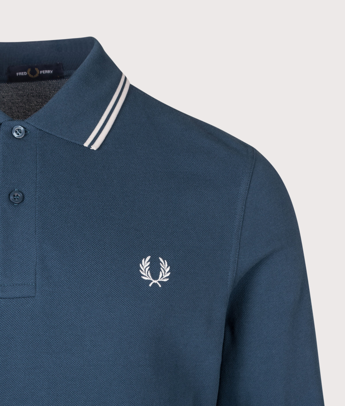 Fred Perry Regular Fit Long Sleeve Twin Tipped Polo Shirt in Mod Blue and Slate at EQVVS Menswear. Detail shot.