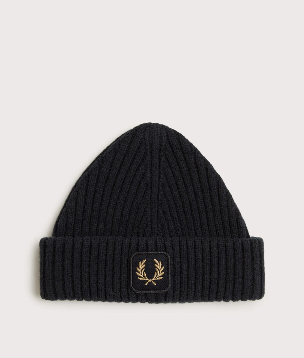 Fred Perry Ribbed Wool Beanie in Black at EQVVS Menswear. Front shot.