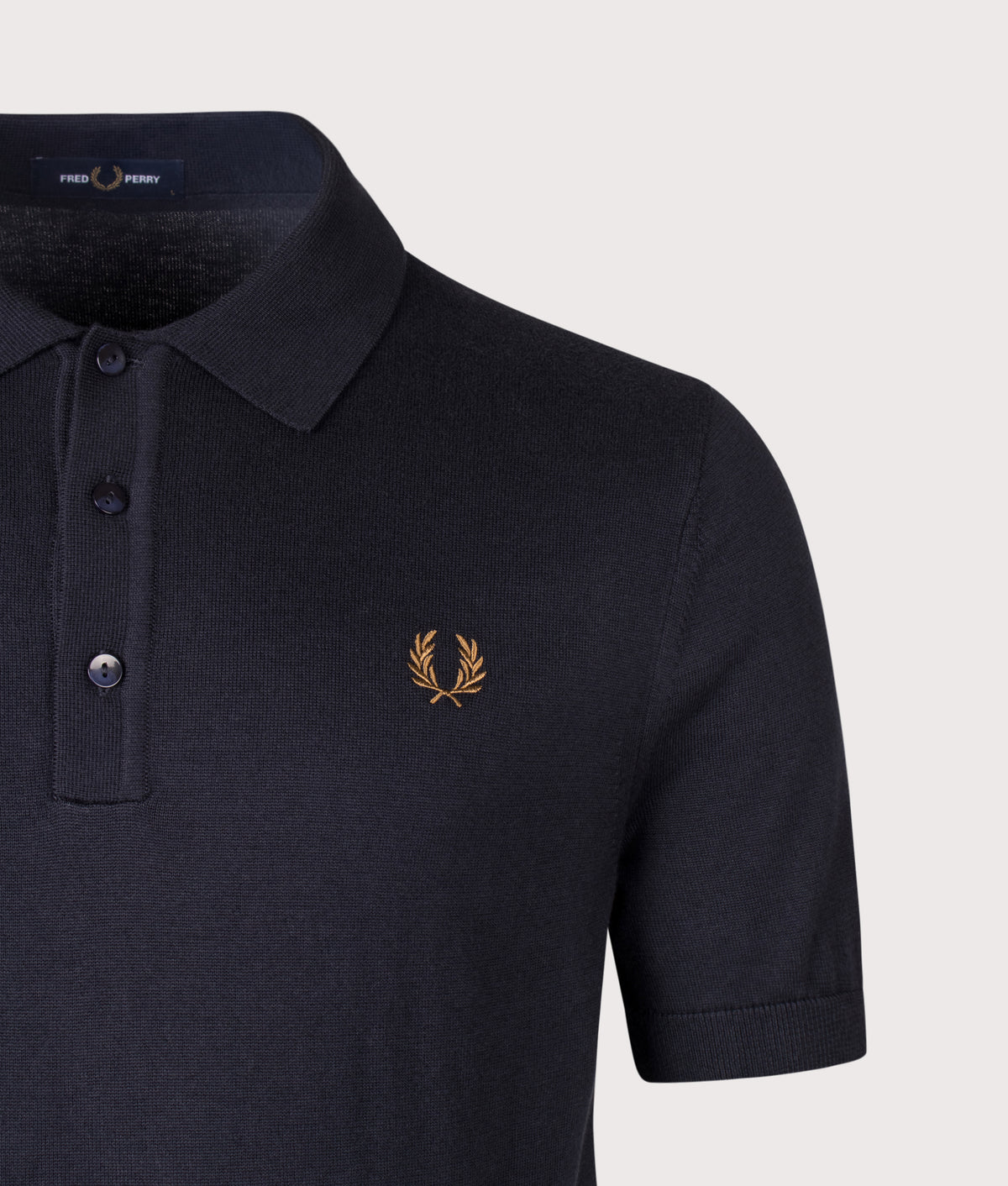 Fred Perry Regular Fit Supima Cotton Knitted Polo Shirt in Navy at EQVVS Menswear. Detail shot.