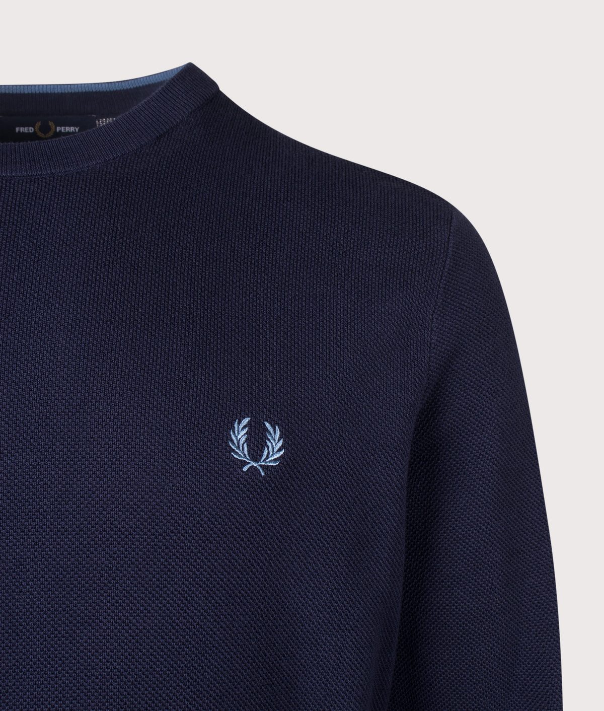 Fred Perry Regular Fit Piqué Stitch Jumper in Twilight Navy at EQVVS Menswear. Detail shot.