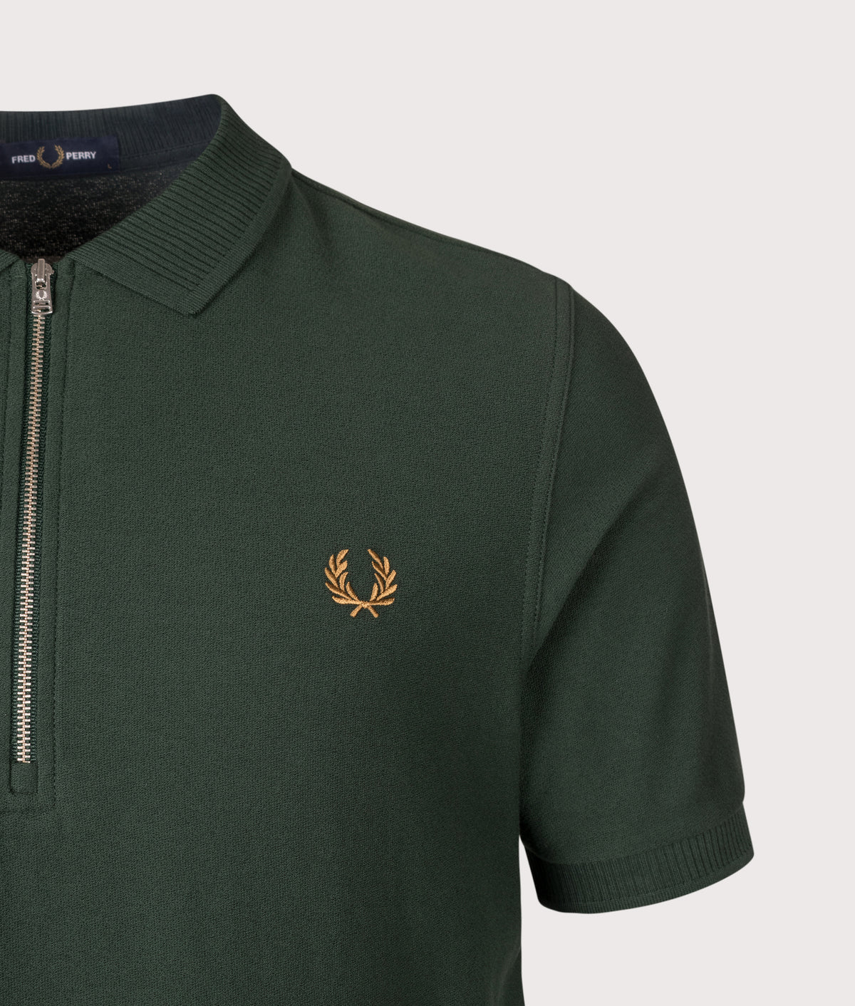 Fred Perry Regular Fit Crepe Piqué Polo Shirt in Grassroots at EQVVS Menswear. Detail shot.
