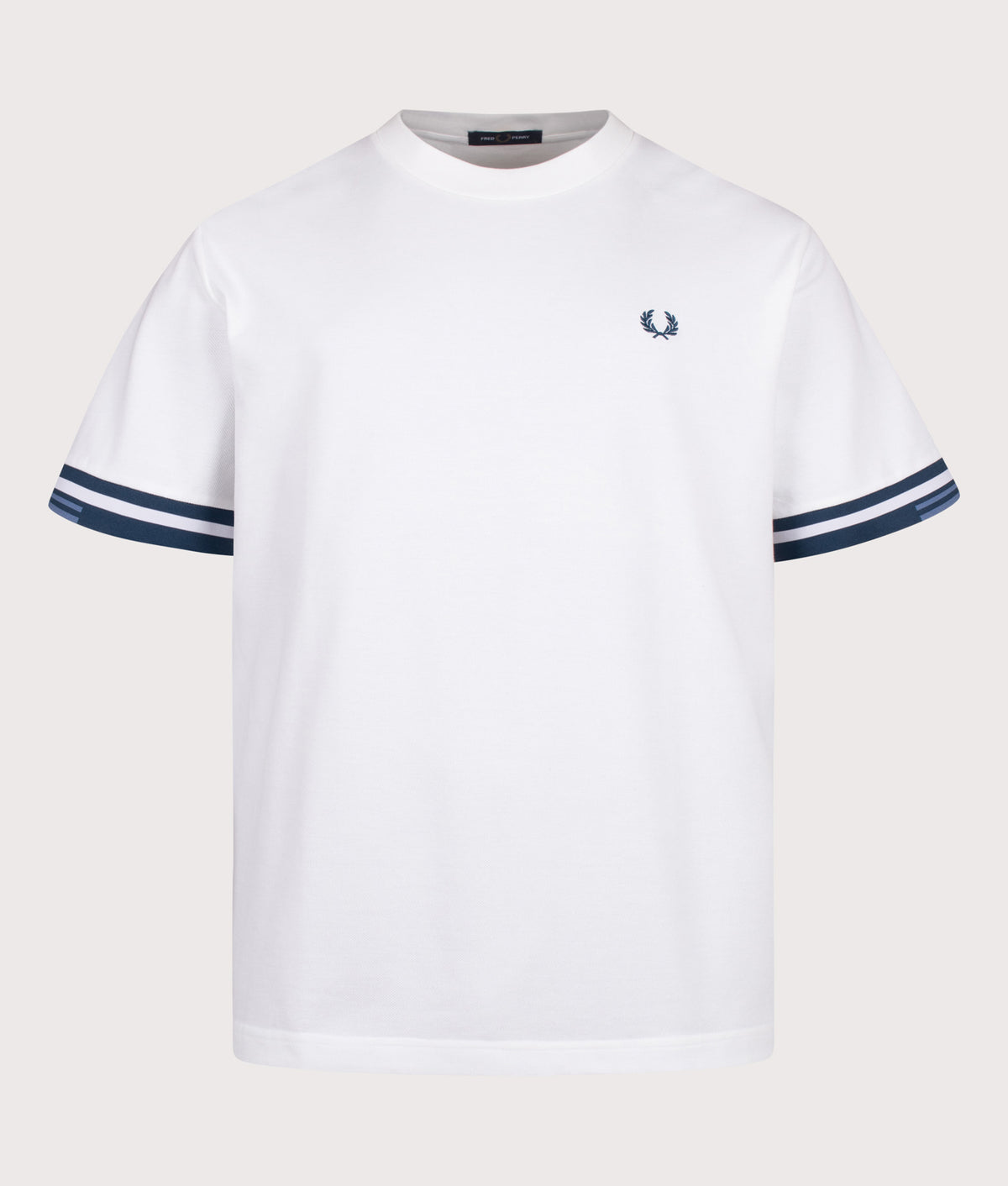 Fred Perry release the Relaxed Fit Tipped Cuff Pique T-Shirt in White at EQVVS Menswear. Front shot.