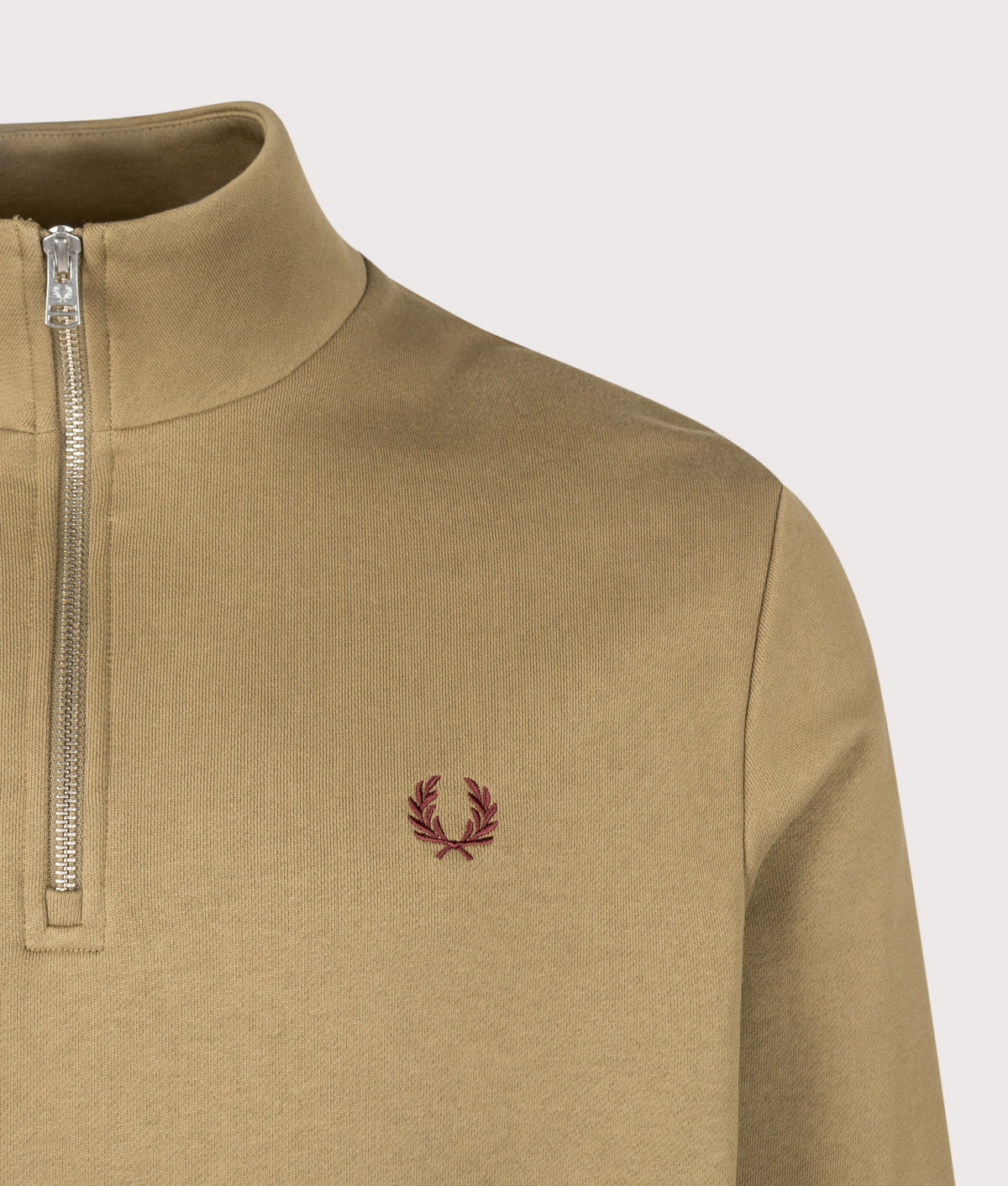 Fred Perry Regular Fit Quarter Zip Sweatshirt in Bronze, Ecru and Oxblood at EQVVS Menswear. Detail shot.