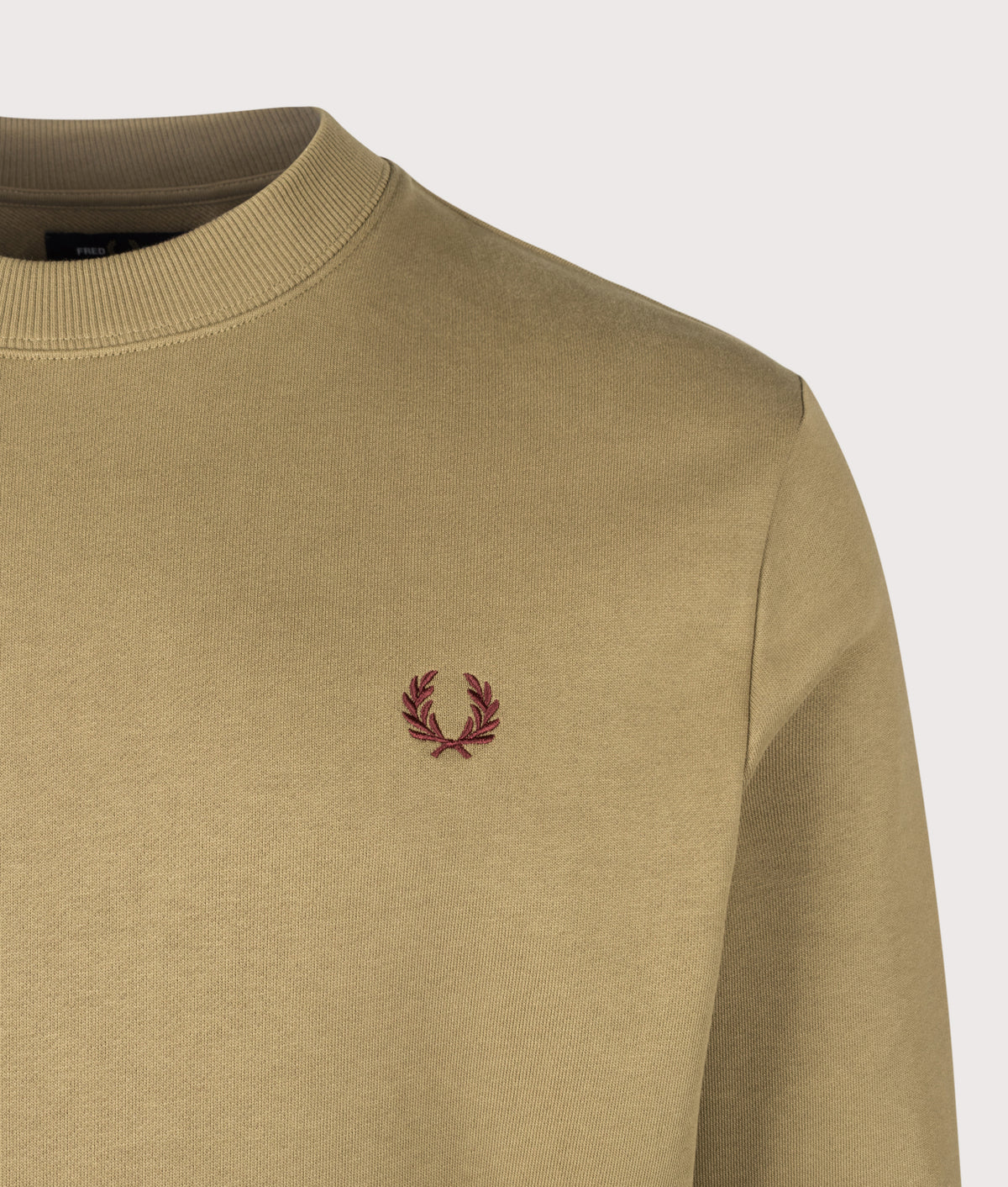 Fred Perry Regular Fit Crew Neck Sweatshirt in Bronze, Ecru and Oxblood at EQVVS Menswear. Detail shot.