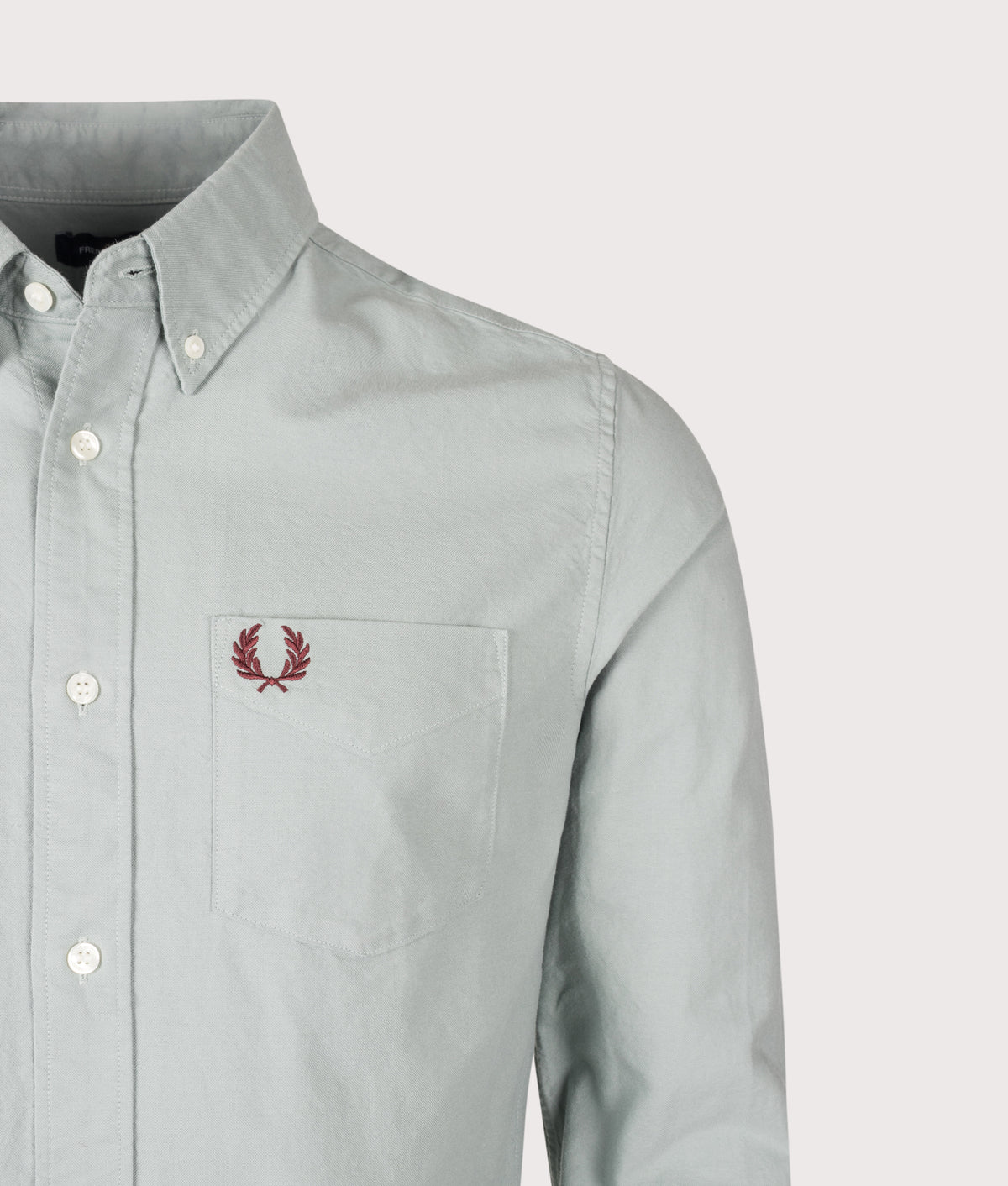 Fred Perry essential Regular Fit Oxford Shirt in Silver Blue at EQVVS Menswear. Detail shot.