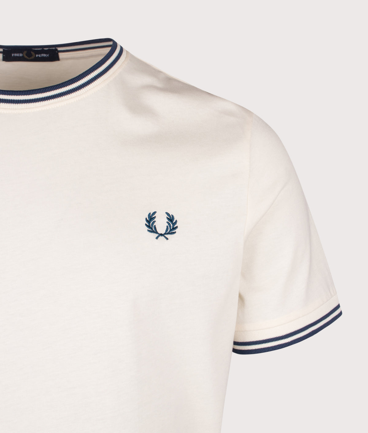 Fred Perry Twin Tipped T-Shirt in Ecru and Mod Blue at EQVVS Menswear. Detail shot.