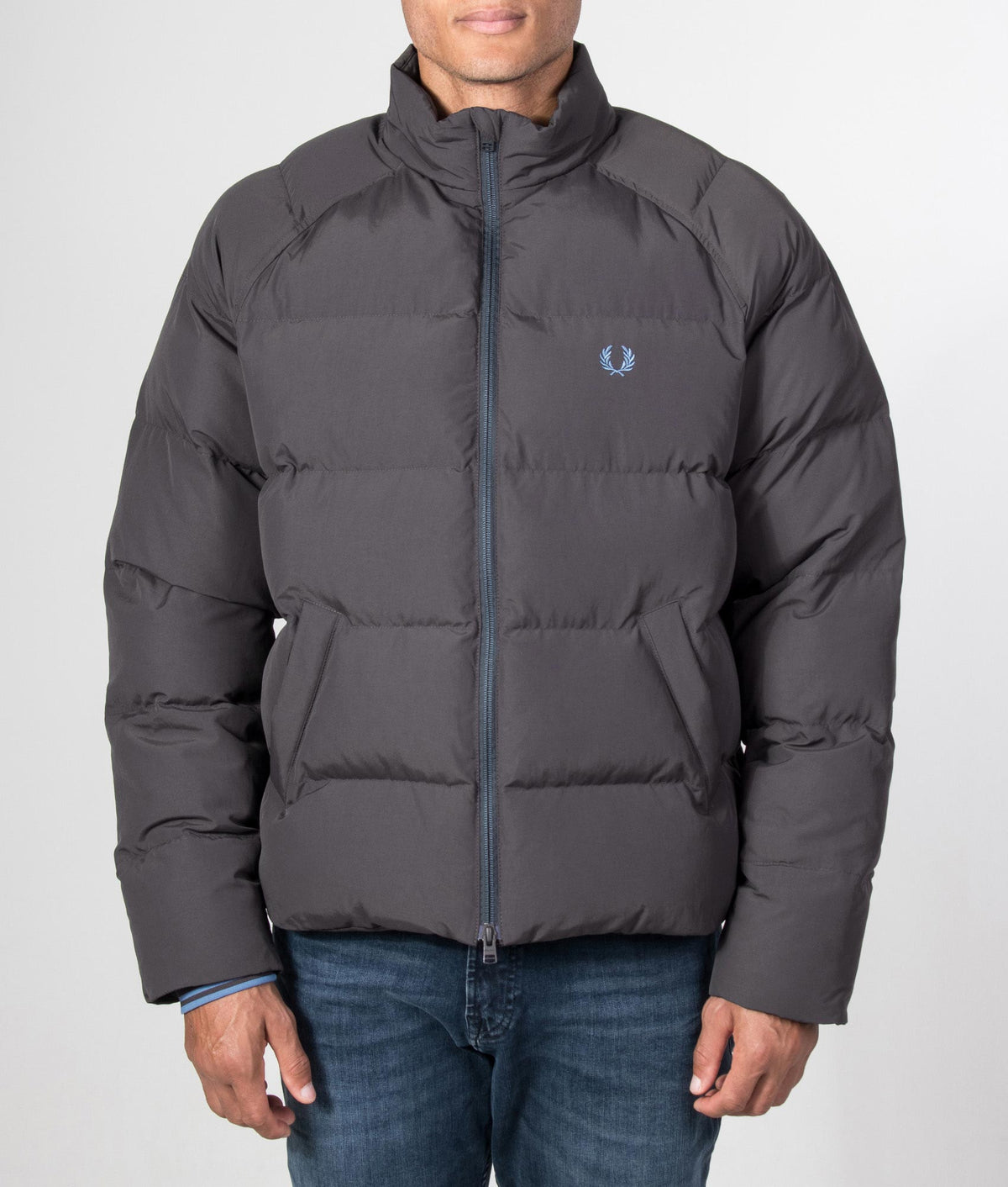 Fred Perry Regular Fit Raglan Sleeve Padded Jacket in Anchor grey at EQVVS Menswear. Model front shot.