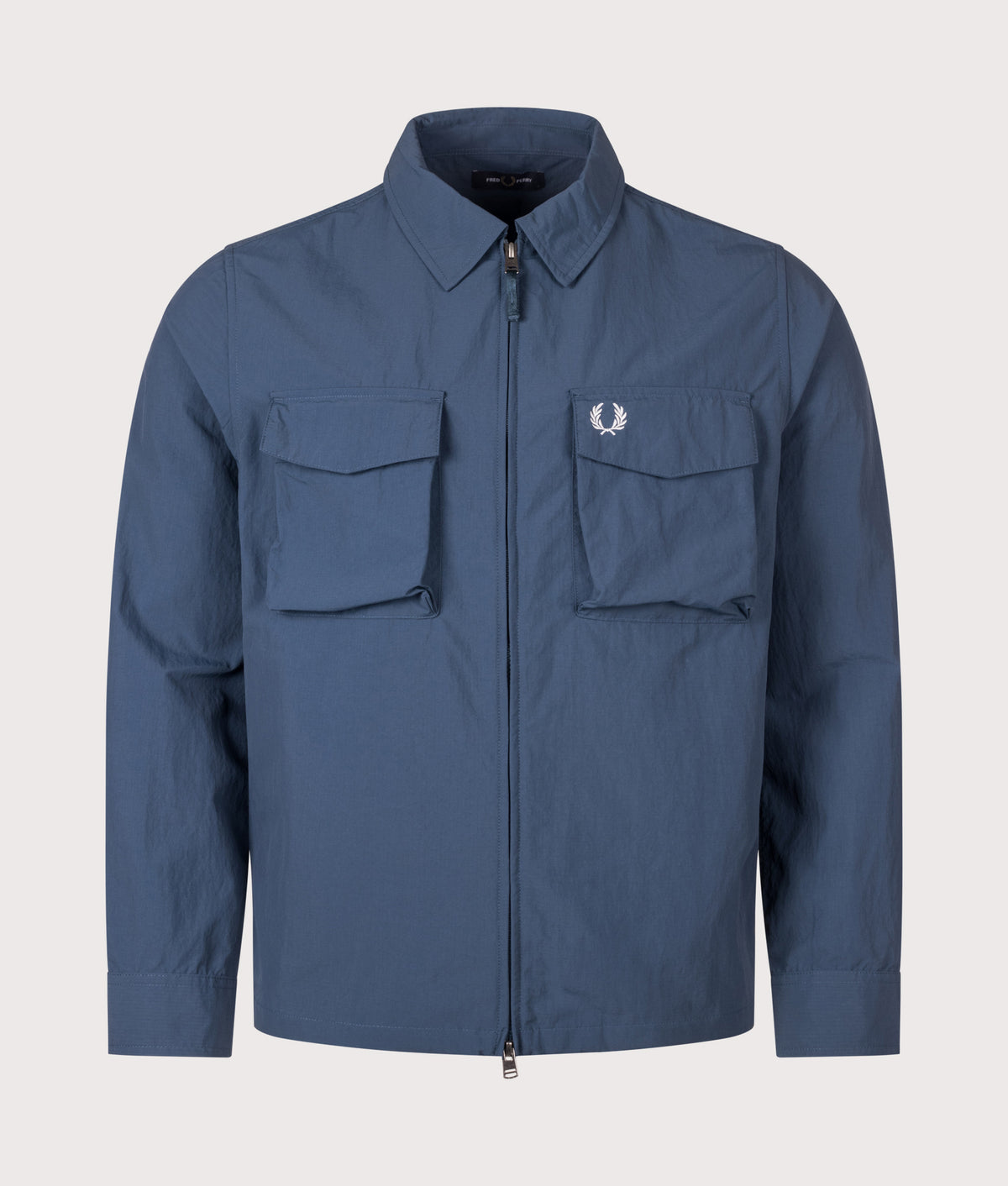 Fred Perry Ripstop Pocket Overshirt in Mod Blue at EQVVS Menswear. Front shot.
