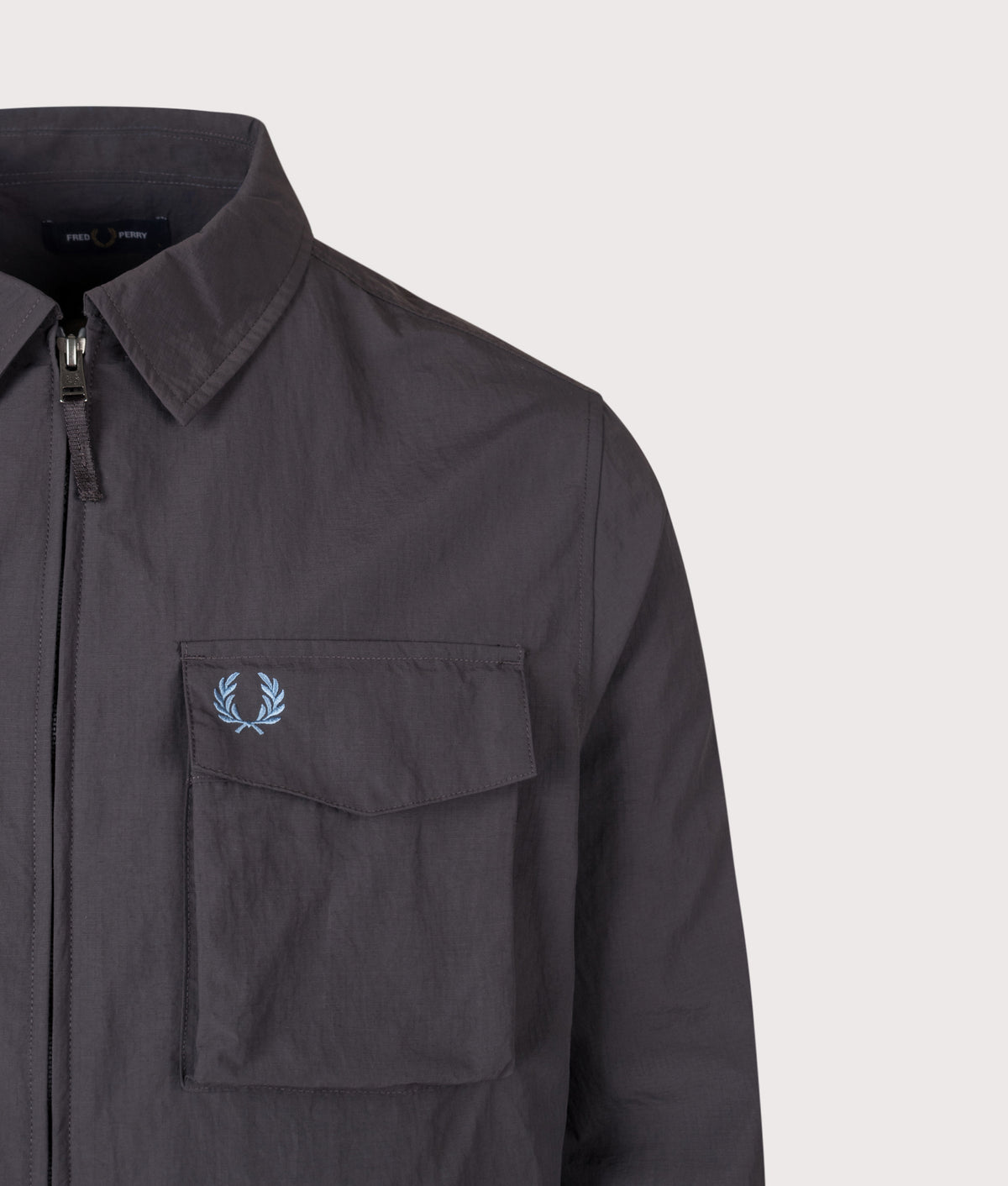 Fred Perry Ripstop Pocket Overshirt in Anchor Grey at EQVVS Menswear. Detail shot.