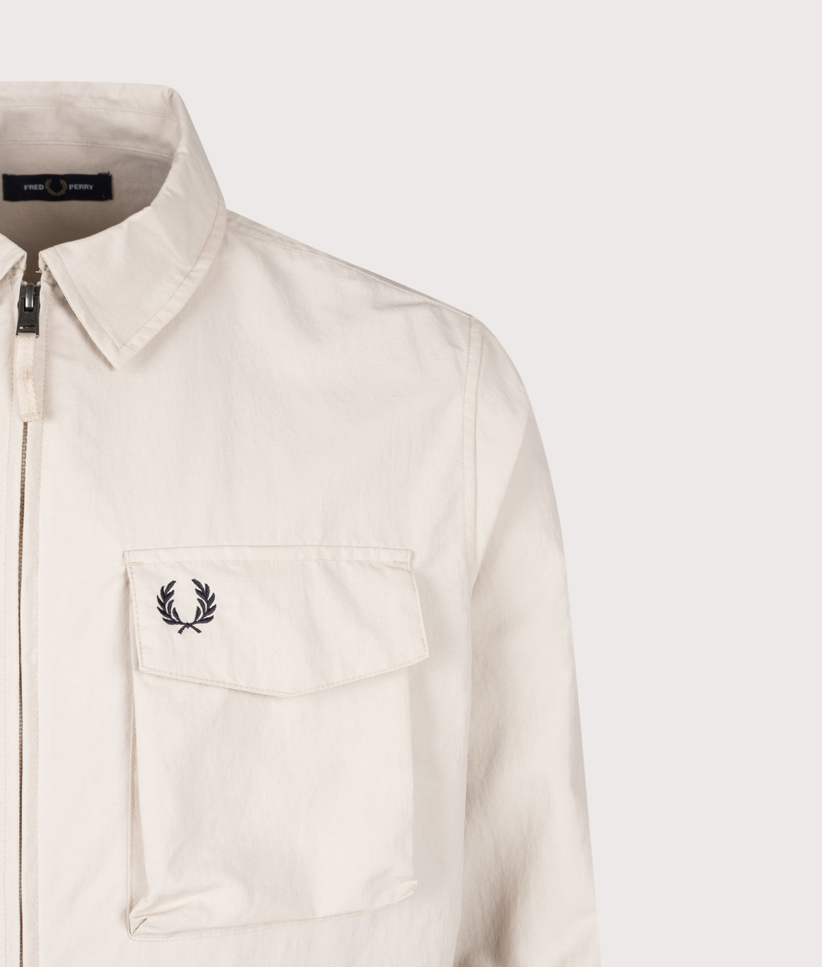 Fred Perry Ripstop Pocket Overshirt in Oatmeal at EQVVS Menswear. Detail shot.