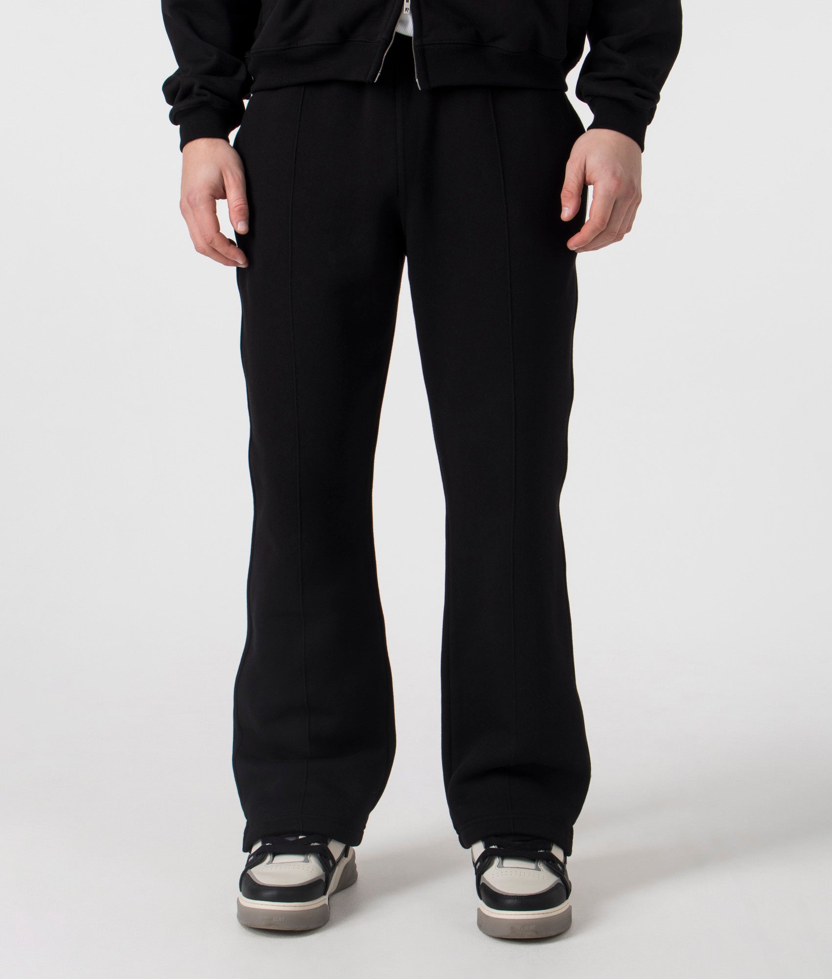 REPRESENT Initial Joggers in Black. Shot at EQVVS. Front shot. 