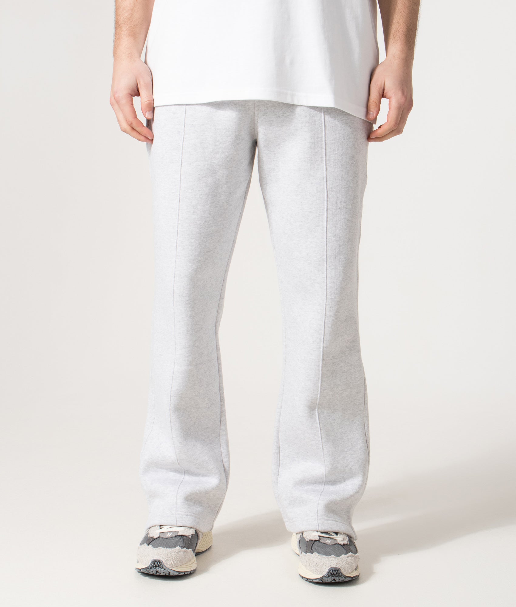 REPRESENT Initial Joggers in Ice Grey Marl at EQVVS Menswear. Front model shot 