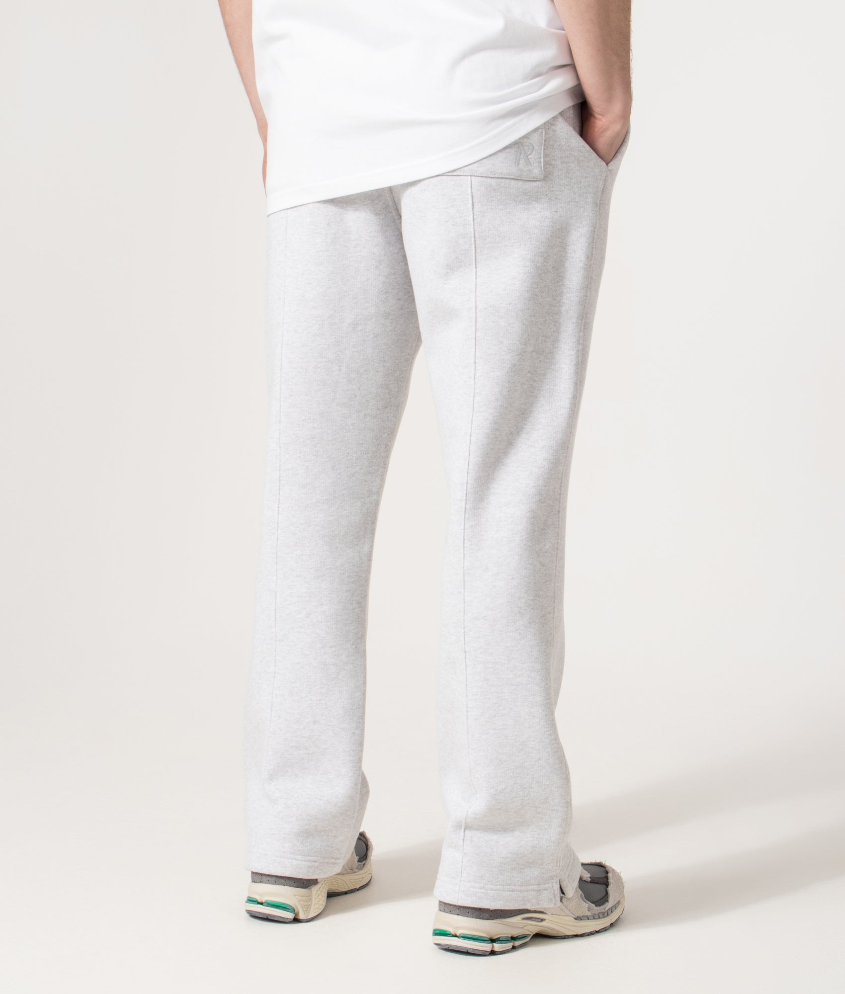 REPRESENT Initial Joggers in Ice Grey Marl at EQVVS Menswear. Back angle model shot 