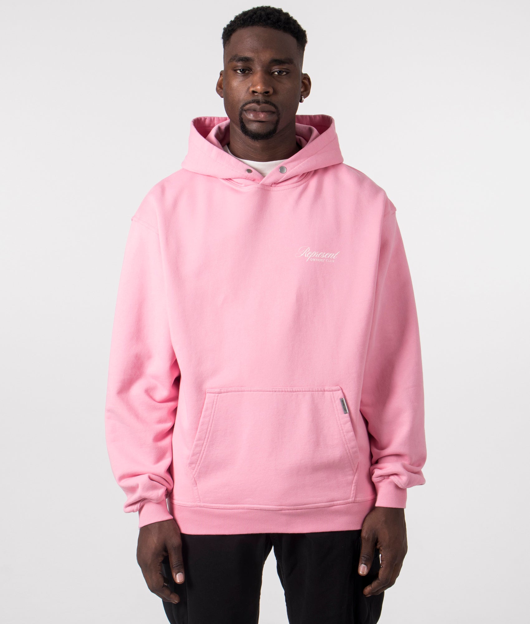 Represent Owners Club Script Hoodie in Pink by Represent at EQVVS. Front  Detail Model Shot.  