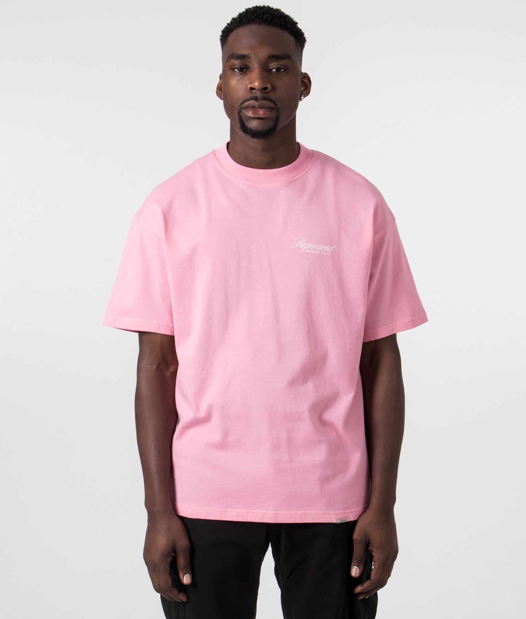 Represent Owners Club Script T-Shirt in Pink by Represent at EQVVS. Front Detail  Model Shot. 