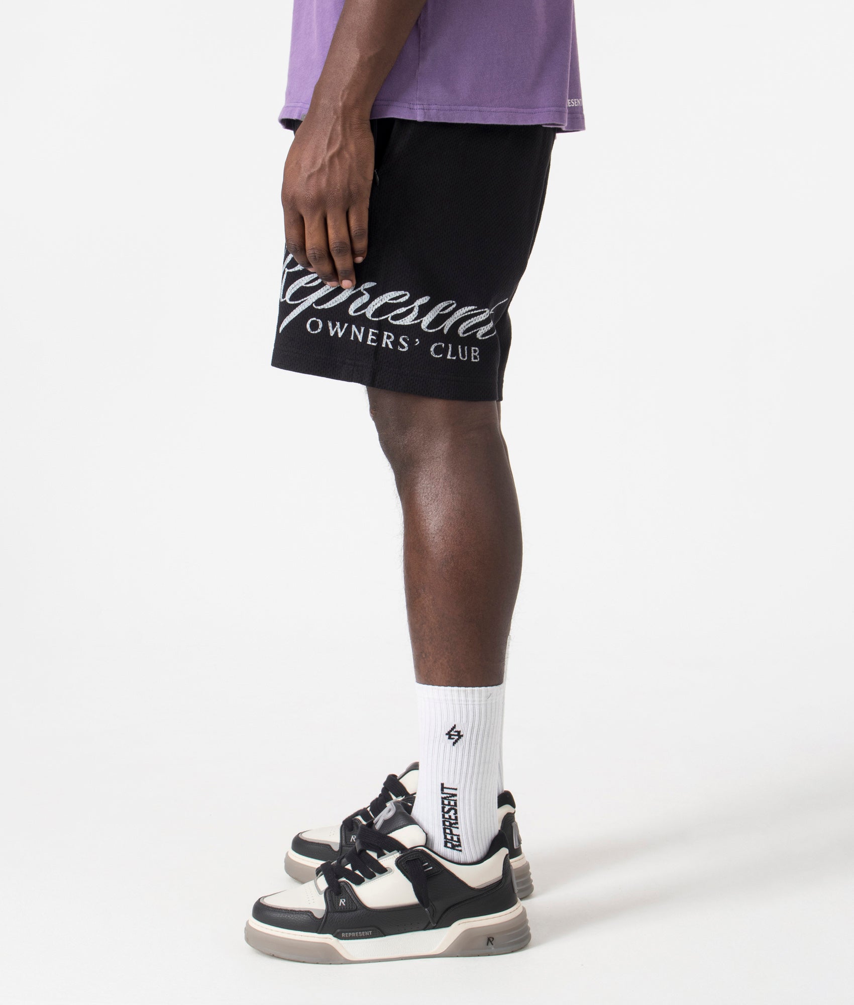 REPRESENT Owners Club Script Mesh Shorts in Black, 100% Cotton. At EQVVS Menswear. Left Side Detail Model Shot